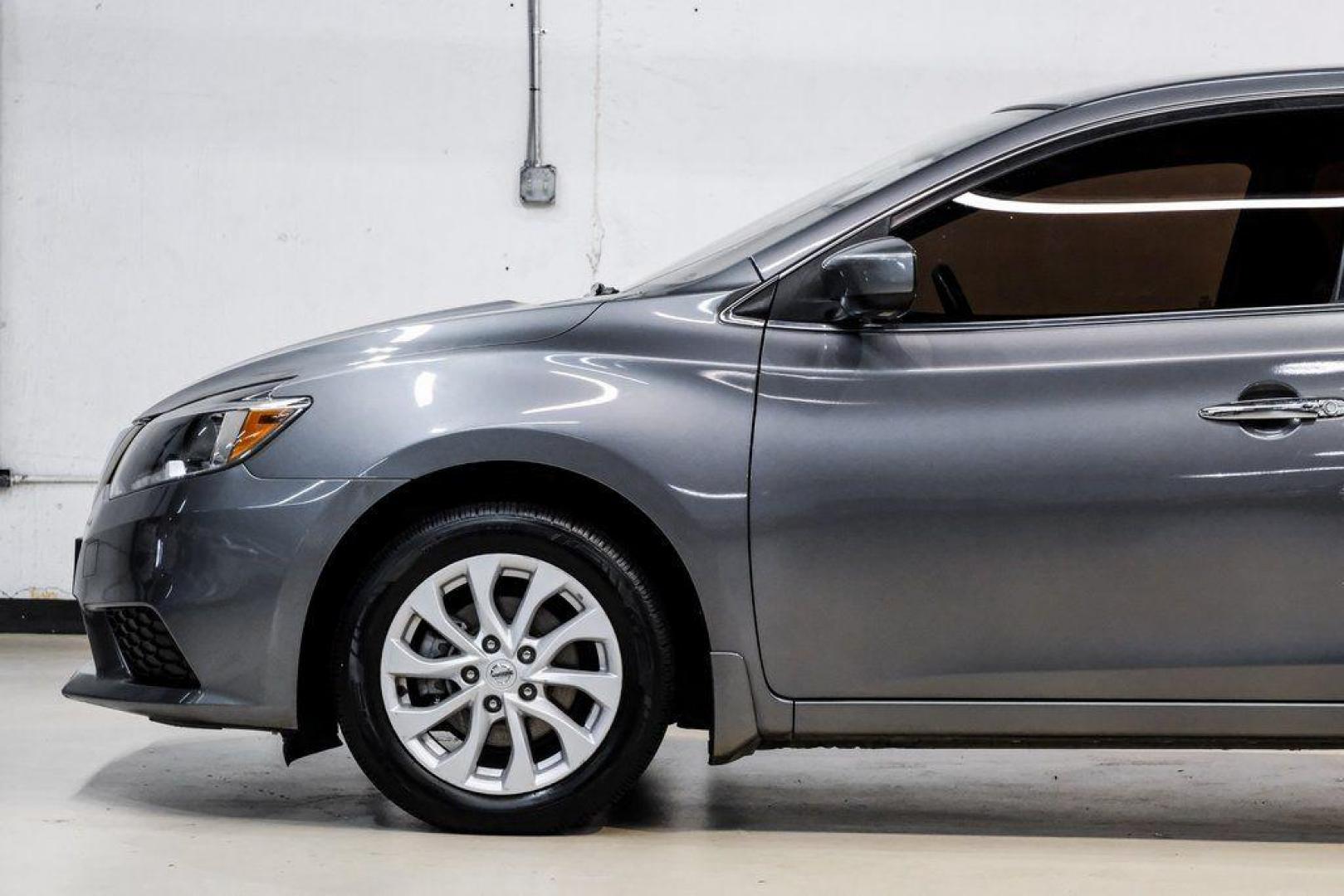 2019 Gun Metallic /Charcoal Nissan Sentra SV (3N1AB7AP4KL) with an 1.8L 4-Cylinder DOHC 16V engine, CVT transmission, located at 15300 Midway Rd., Addison, TX, 75001, (972) 702-0011, 32.958321, -96.838074 - 2019 Nissan Sentra SV<br><br>Now Available at Midway Auto Group, Addison, Texas<br><br>Comfortable, efficient, and packed with the 2019 Nissan Sentra SV is a step up from the base model, offering upgraded technology, refined interior features, and excellent fuel economy. With its spacious cabin and - Photo#19