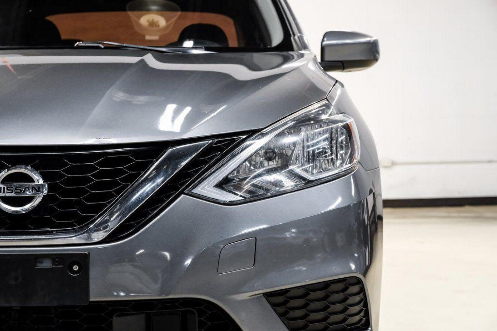 2019 Gun Metallic /Charcoal Nissan Sentra SV (3N1AB7AP4KL) with an 1.8L 4-Cylinder DOHC 16V engine, CVT transmission, located at 15300 Midway Rd., Addison, TX, 75001, (972) 702-0011, 32.958321, -96.838074 - 2019 Nissan Sentra SV<br><br>Now Available at Midway Auto Group, Addison, Texas<br><br>Comfortable, efficient, and packed with the 2019 Nissan Sentra SV is a step up from the base model, offering upgraded technology, refined interior features, and excellent fuel economy. With its spacious cabin and - Photo#55