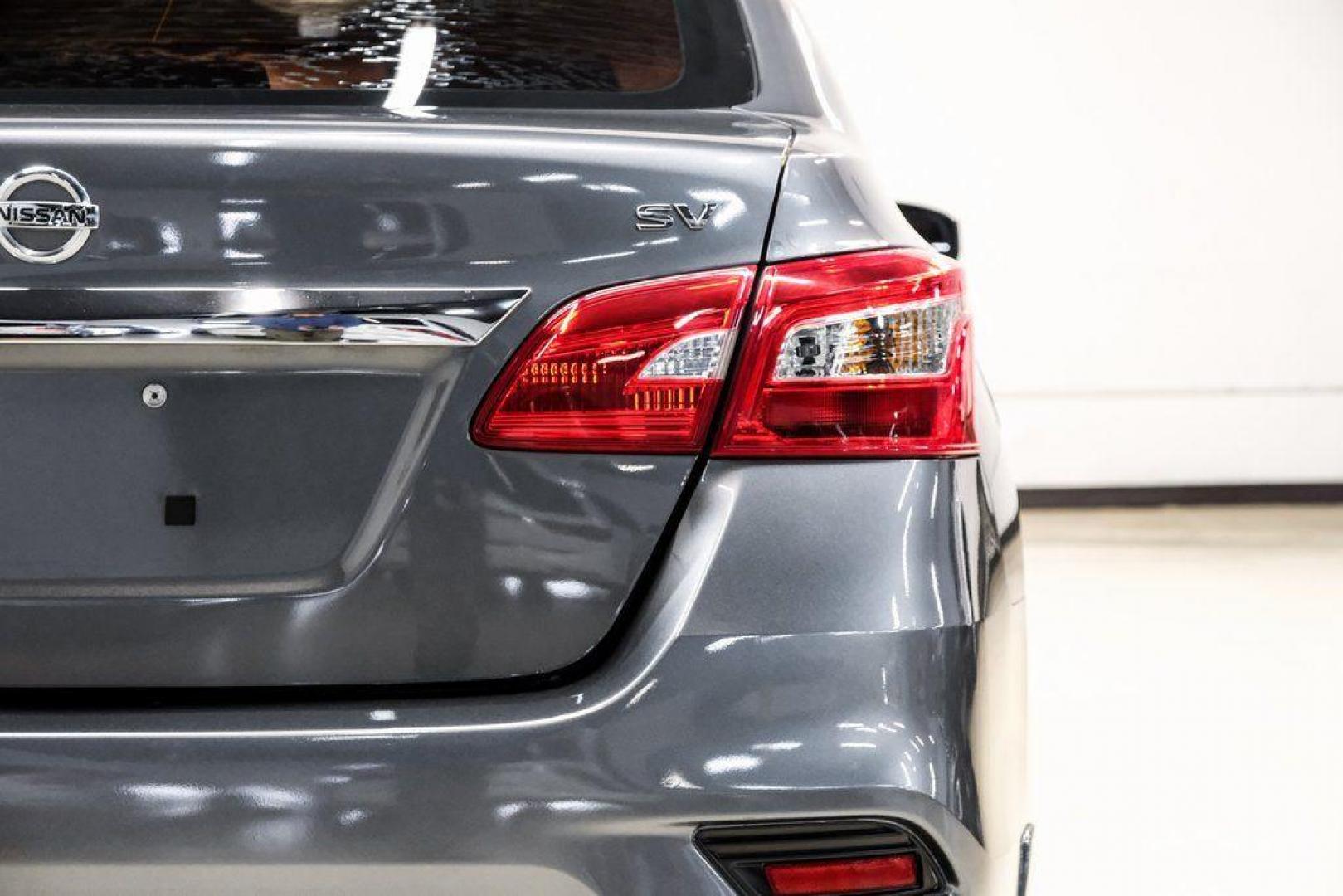 2019 Gun Metallic /Charcoal Nissan Sentra SV (3N1AB7AP4KL) with an 1.8L 4-Cylinder DOHC 16V engine, CVT transmission, located at 15300 Midway Rd., Addison, TX, 75001, (972) 702-0011, 32.958321, -96.838074 - 2019 Nissan Sentra SV<br><br>Now Available at Midway Auto Group, Addison, Texas<br><br>Comfortable, efficient, and packed with the 2019 Nissan Sentra SV is a step up from the base model, offering upgraded technology, refined interior features, and excellent fuel economy. With its spacious cabin and - Photo#56