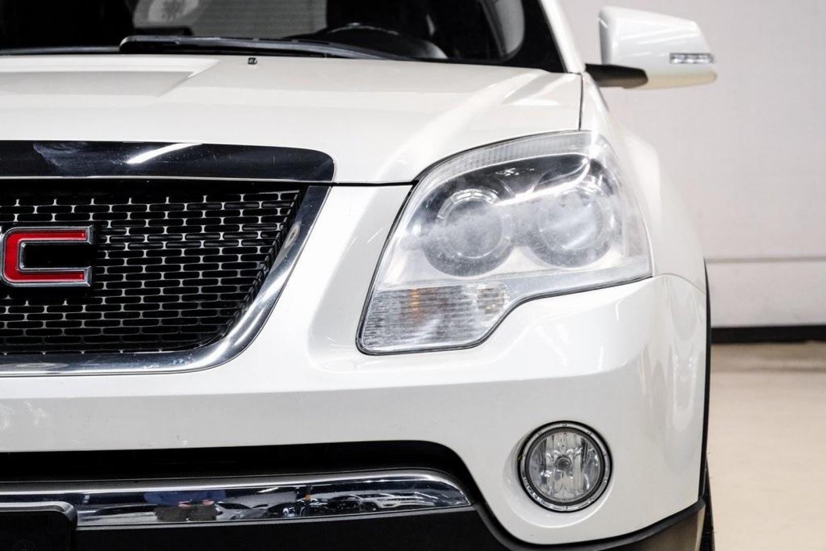 2009 White Diamond Tricoat /Ebony GMC Acadia SLT-2 (1GKER33D19J) with an 3.6L V6 SIDI engine, Automatic transmission, located at 15300 Midway Rd., Addison, TX, 75001, (972) 702-0011, 32.958321, -96.838074 - 2009 GMC Acadia SLT-2<br><br>Now Available at Midway Auto Group, Addison, Texas<br><br>Premium, spacious, and family-readythe 2009 GMC Acadia SLT-2 delivers upscale features, three-row flexibility, and strong V6 performance. As one of the highest trim levels available, the SLT-2 offers luxury-grade - Photo#62