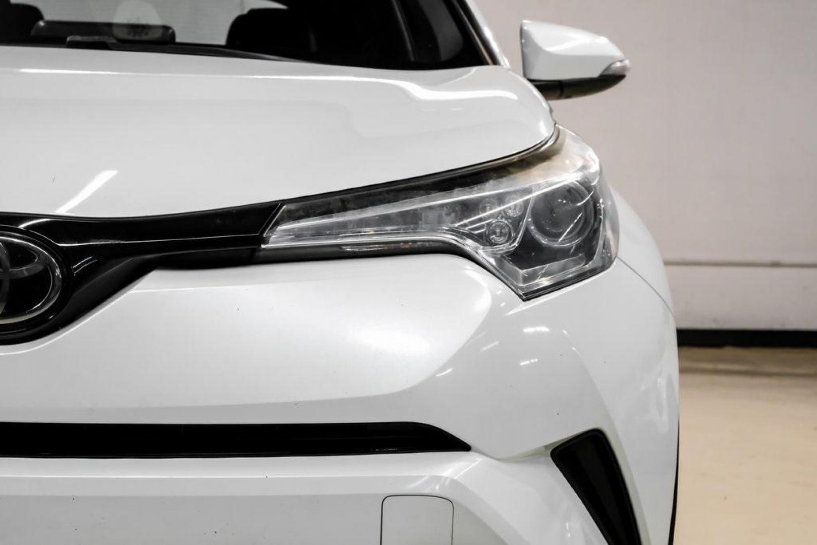 2019 Blizzard Pearl /Black Toyota C-HR XLE (NMTKHMBX6KR) with an 2.0L I4 DOHC 16V engine, CVT transmission, located at 15300 Midway Rd., Addison, TX, 75001, (972) 702-0011, 32.958321, -96.838074 - Photo#51