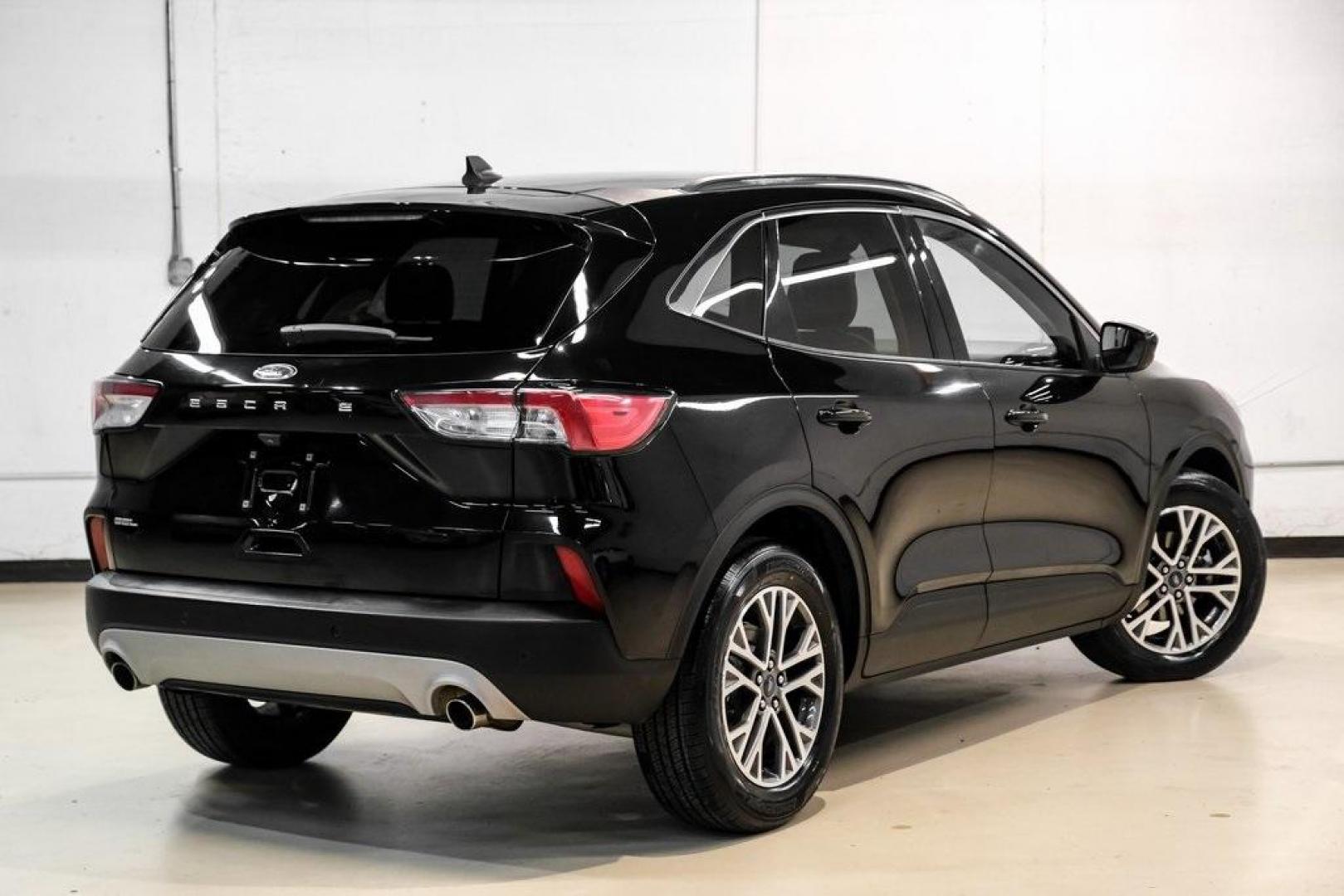 2021 Black Metallic /Sandstone Ford Escape SEL (1FMCU0H62MU) with an 1.5L EcoBoost engine, Automatic transmission, located at 15300 Midway Rd., Addison, TX, 75001, (972) 702-0011, 32.958321, -96.838074 - Photo#7