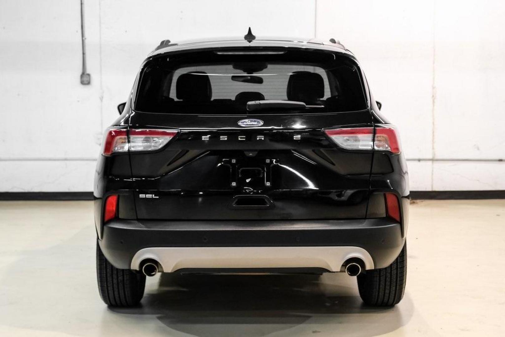 2021 Black Metallic /Sandstone Ford Escape SEL (1FMCU0H62MU) with an 1.5L EcoBoost engine, Automatic transmission, located at 15300 Midway Rd., Addison, TX, 75001, (972) 702-0011, 32.958321, -96.838074 - Photo#8