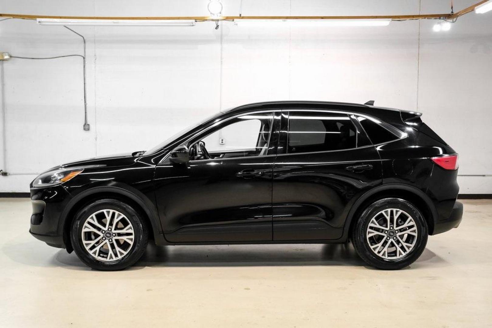 2021 Black Metallic /Sandstone Ford Escape SEL (1FMCU0H62MU) with an 1.5L EcoBoost engine, Automatic transmission, located at 15300 Midway Rd., Addison, TX, 75001, (972) 702-0011, 32.958321, -96.838074 - Photo#10