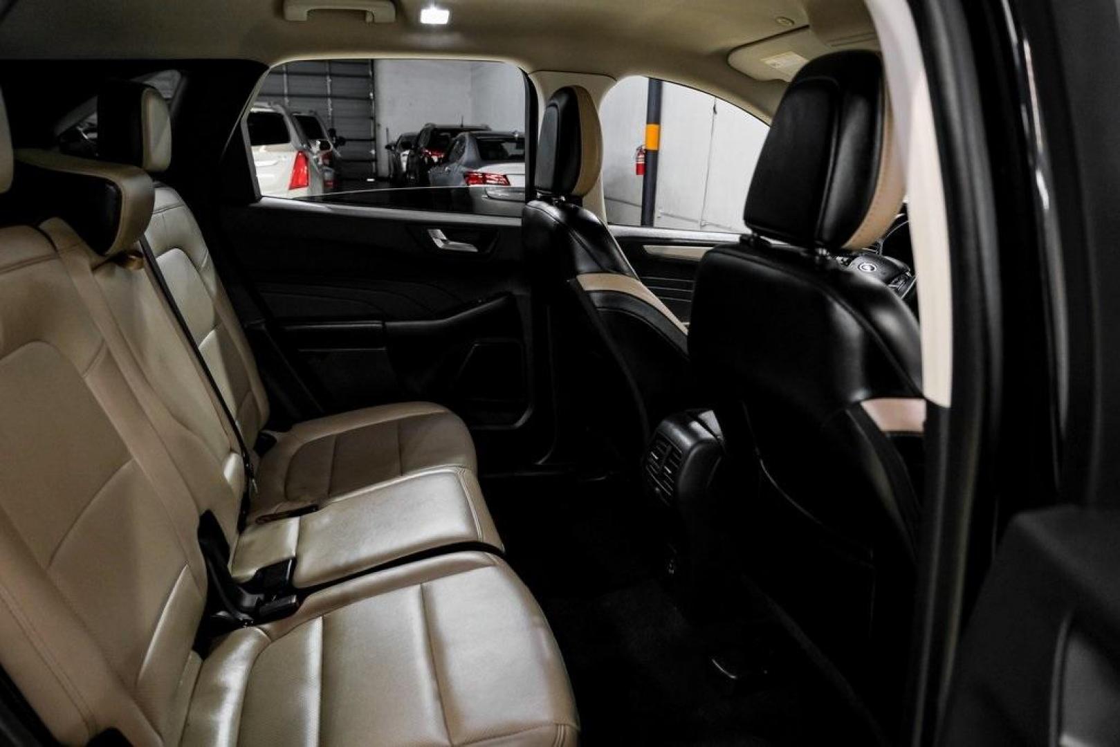 2021 Black Metallic /Sandstone Ford Escape SEL (1FMCU0H62MU) with an 1.5L EcoBoost engine, Automatic transmission, located at 15300 Midway Rd., Addison, TX, 75001, (972) 702-0011, 32.958321, -96.838074 - Photo#30