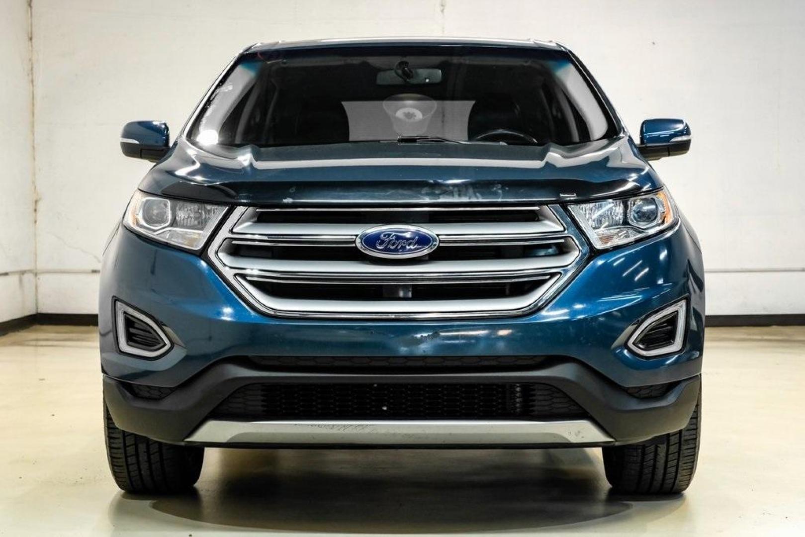 2016 Blue Metallic /Ebony Ford Edge Titanium (2FMPK4K87GB) with an 3.5L V6 Ti-VCT engine, Automatic transmission, located at 15300 Midway Rd., Addison, TX, 75001, (972) 702-0011, 32.958321, -96.838074 - 2016 Ford Edge Titanium AWD<br><br>Now Available at Midway Auto Group Addison, Texas<br><br>Refined, comfortable, and well-equipped, the 2016 Ford Edge Titanium AWD delivers a premium midsize SUV experience with modern technology, a quiet ride, and confident all-wheel-drive capability. As one of th - Photo#4