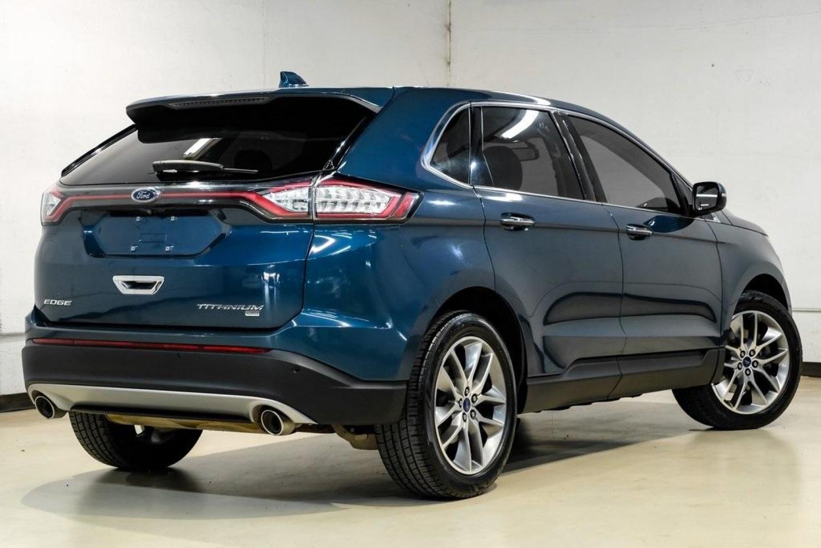 2016 Blue Metallic /Ebony Ford Edge Titanium (2FMPK4K87GB) with an 3.5L V6 Ti-VCT engine, Automatic transmission, located at 15300 Midway Rd., Addison, TX, 75001, (972) 702-0011, 32.958321, -96.838074 - 2016 Ford Edge Titanium AWD<br><br>Now Available at Midway Auto Group Addison, Texas<br><br>Refined, comfortable, and well-equipped, the 2016 Ford Edge Titanium AWD delivers a premium midsize SUV experience with modern technology, a quiet ride, and confident all-wheel-drive capability. As one of th - Photo#7
