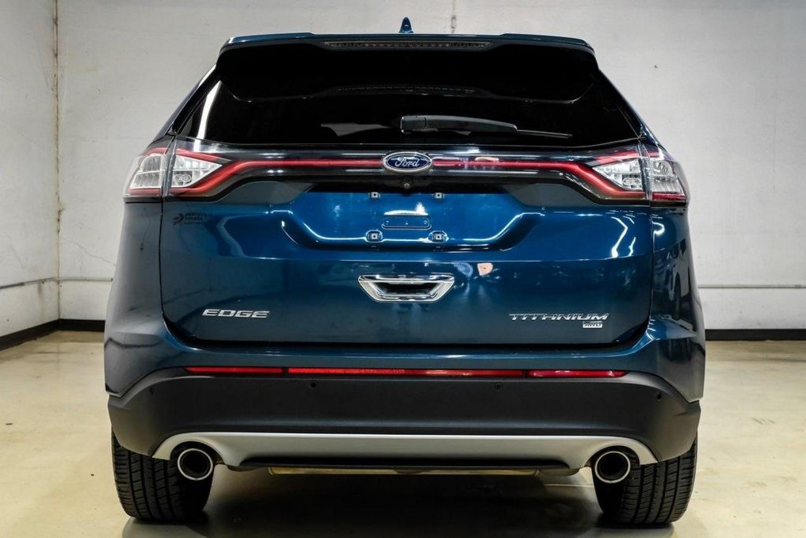 2016 Blue Metallic /Ebony Ford Edge Titanium (2FMPK4K87GB) with an 3.5L V6 Ti-VCT engine, Automatic transmission, located at 15300 Midway Rd., Addison, TX, 75001, (972) 702-0011, 32.958321, -96.838074 - 2016 Ford Edge Titanium AWD<br><br>Now Available at Midway Auto Group Addison, Texas<br><br>Refined, comfortable, and well-equipped, the 2016 Ford Edge Titanium AWD delivers a premium midsize SUV experience with modern technology, a quiet ride, and confident all-wheel-drive capability. As one of th - Photo#8