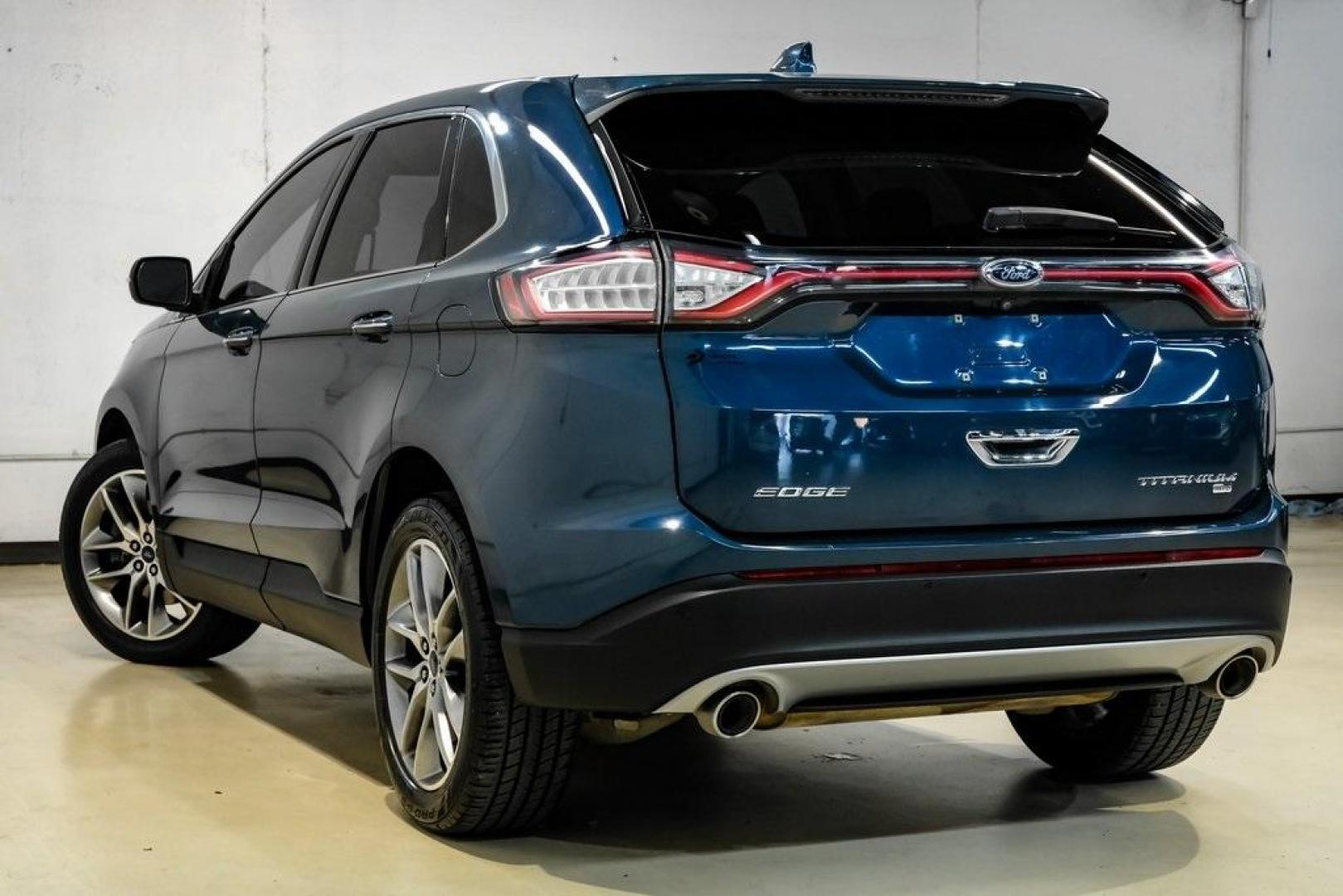 2016 Blue Metallic /Ebony Ford Edge Titanium (2FMPK4K87GB) with an 3.5L V6 Ti-VCT engine, Automatic transmission, located at 15300 Midway Rd., Addison, TX, 75001, (972) 702-0011, 32.958321, -96.838074 - 2016 Ford Edge Titanium AWD<br><br>Now Available at Midway Auto Group Addison, Texas<br><br>Refined, comfortable, and well-equipped, the 2016 Ford Edge Titanium AWD delivers a premium midsize SUV experience with modern technology, a quiet ride, and confident all-wheel-drive capability. As one of th - Photo#9