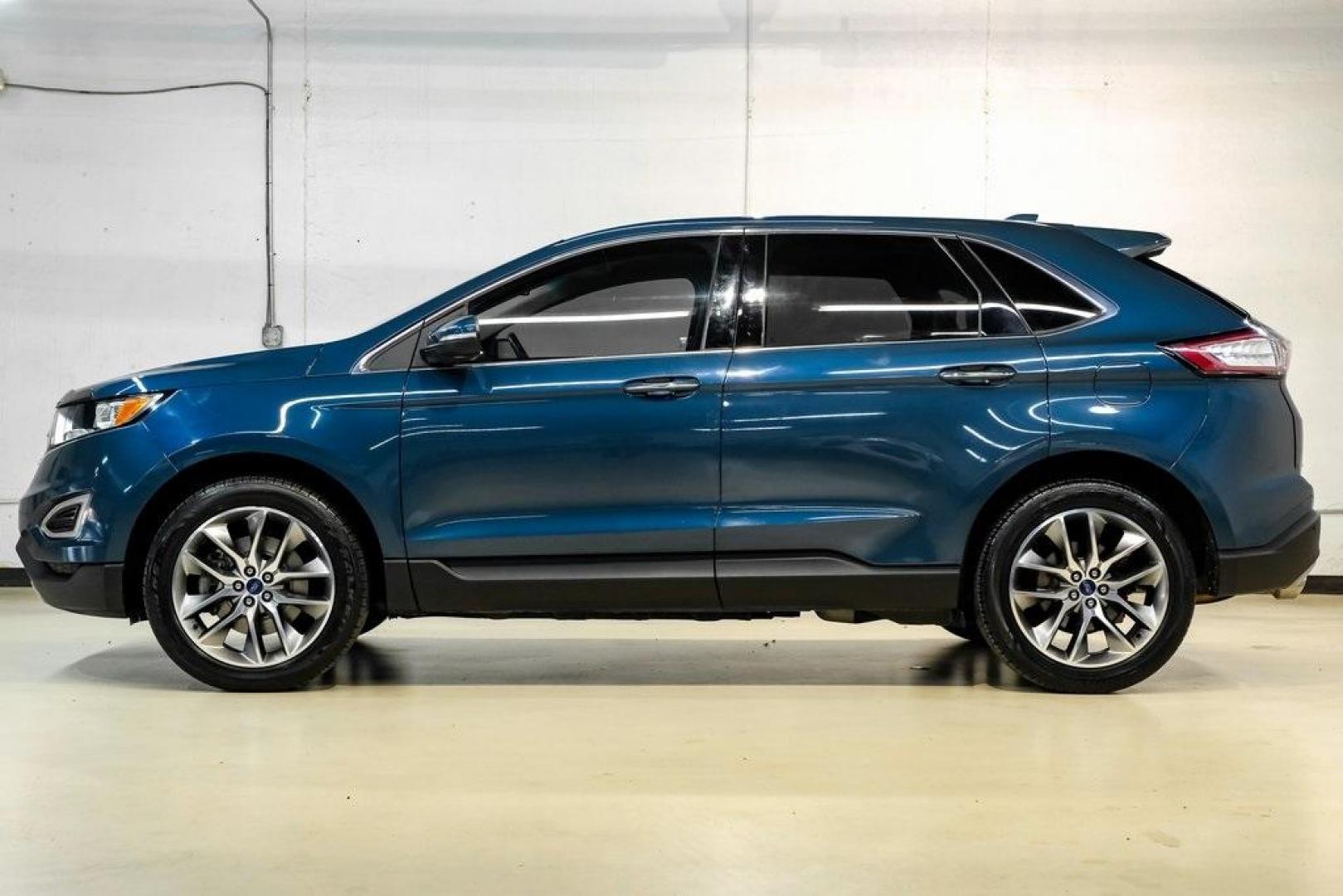 2016 Blue Metallic /Ebony Ford Edge Titanium (2FMPK4K87GB) with an 3.5L V6 Ti-VCT engine, Automatic transmission, located at 15300 Midway Rd., Addison, TX, 75001, (972) 702-0011, 32.958321, -96.838074 - 2016 Ford Edge Titanium AWD<br><br>Now Available at Midway Auto Group Addison, Texas<br><br>Refined, comfortable, and well-equipped, the 2016 Ford Edge Titanium AWD delivers a premium midsize SUV experience with modern technology, a quiet ride, and confident all-wheel-drive capability. As one of th - Photo#10