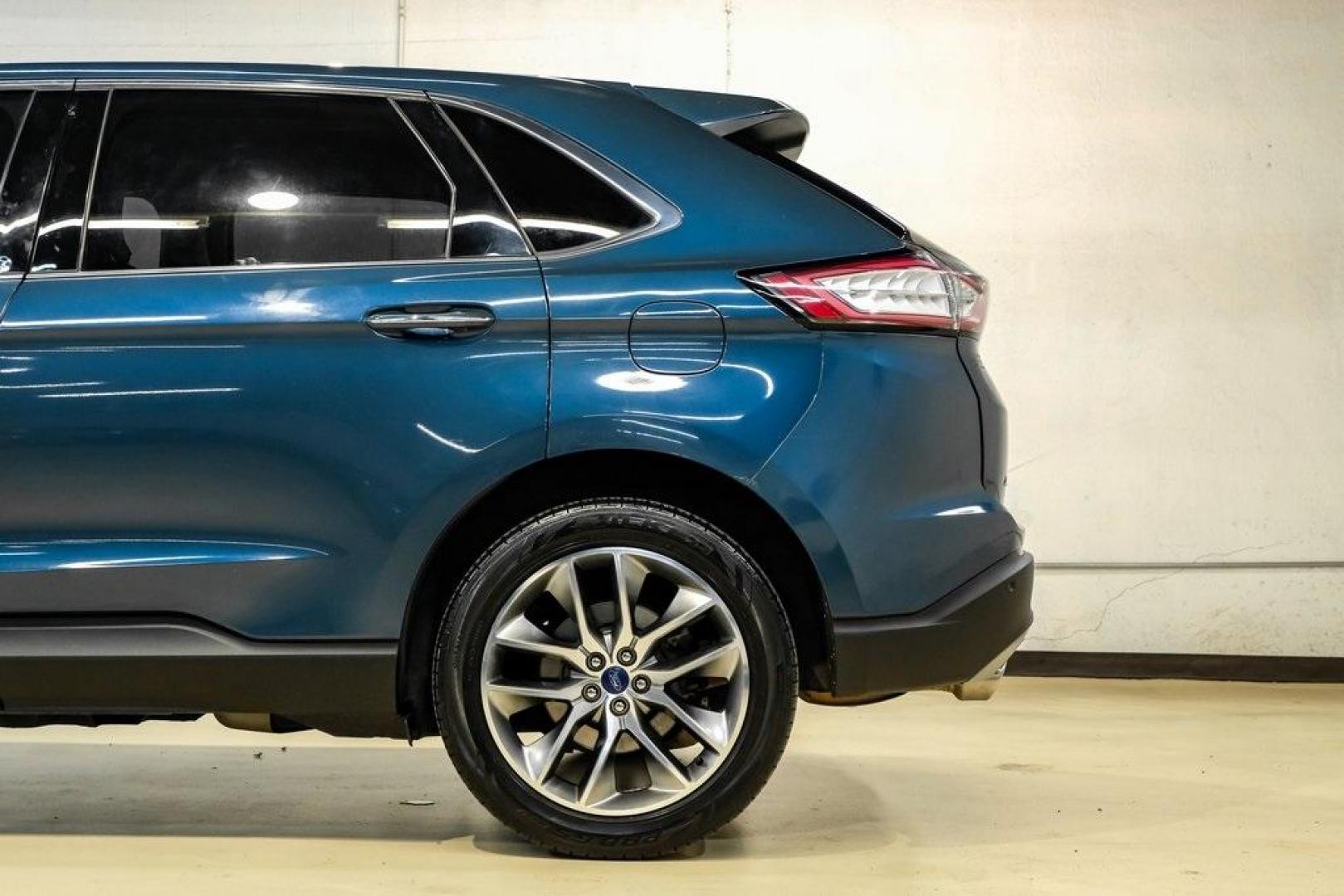 2016 Blue Metallic /Ebony Ford Edge Titanium (2FMPK4K87GB) with an 3.5L V6 Ti-VCT engine, Automatic transmission, located at 15300 Midway Rd., Addison, TX, 75001, (972) 702-0011, 32.958321, -96.838074 - 2016 Ford Edge Titanium AWD<br><br>Now Available at Midway Auto Group Addison, Texas<br><br>Refined, comfortable, and well-equipped, the 2016 Ford Edge Titanium AWD delivers a premium midsize SUV experience with modern technology, a quiet ride, and confident all-wheel-drive capability. As one of th - Photo#12