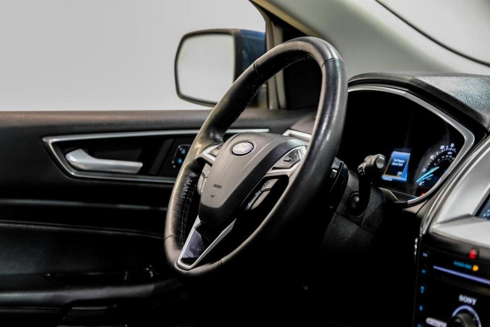 2016 Blue Metallic /Ebony Ford Edge Titanium (2FMPK4K87GB) with an 3.5L V6 Ti-VCT engine, Automatic transmission, located at 15300 Midway Rd., Addison, TX, 75001, (972) 702-0011, 32.958321, -96.838074 - 2016 Ford Edge Titanium AWD<br><br>Now Available at Midway Auto Group Addison, Texas<br><br>Refined, comfortable, and well-equipped, the 2016 Ford Edge Titanium AWD delivers a premium midsize SUV experience with modern technology, a quiet ride, and confident all-wheel-drive capability. As one of th - Photo#14