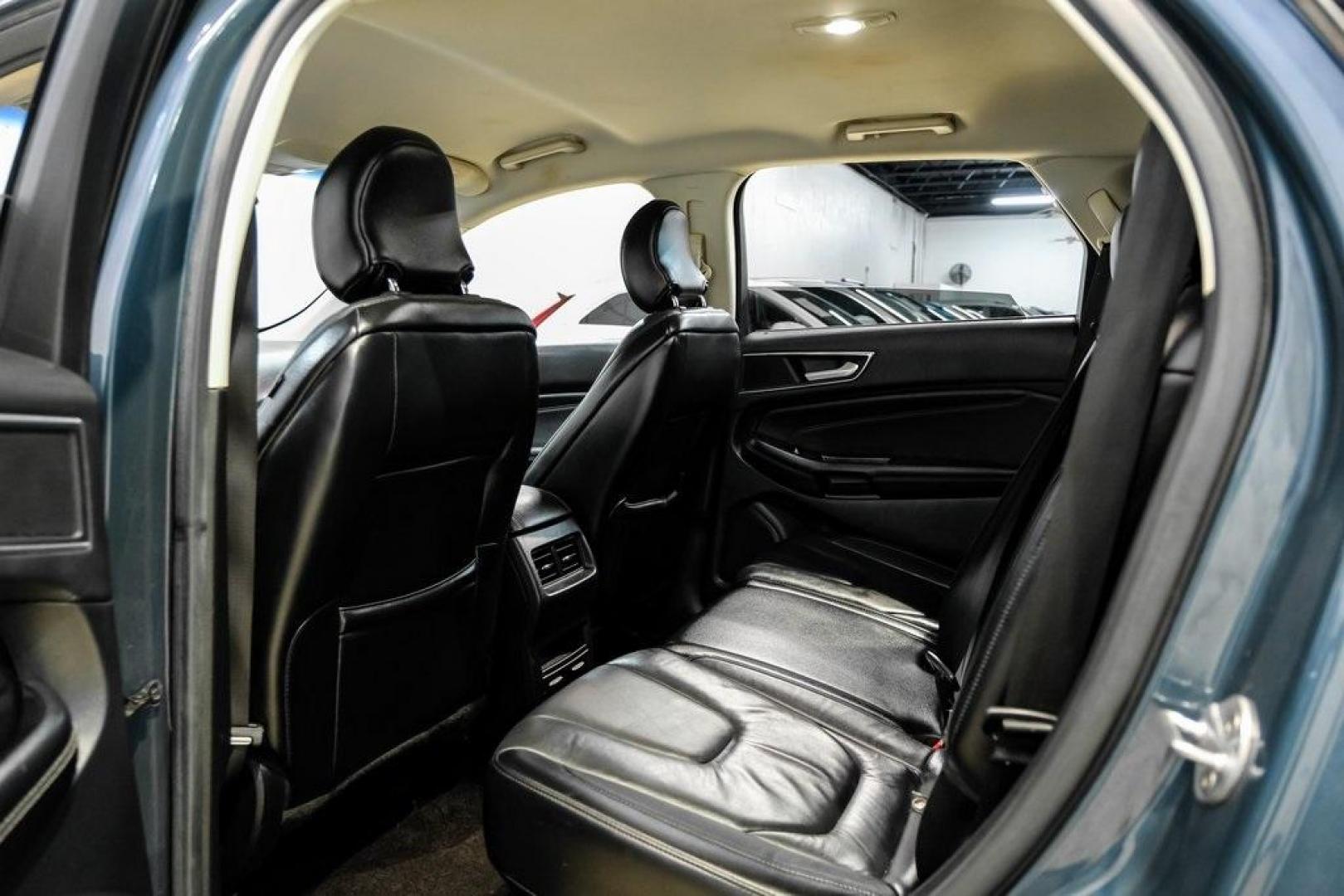 2016 Blue Metallic /Ebony Ford Edge Titanium (2FMPK4K87GB) with an 3.5L V6 Ti-VCT engine, Automatic transmission, located at 15300 Midway Rd., Addison, TX, 75001, (972) 702-0011, 32.958321, -96.838074 - 2016 Ford Edge Titanium AWD<br><br>Now Available at Midway Auto Group Addison, Texas<br><br>Refined, comfortable, and well-equipped, the 2016 Ford Edge Titanium AWD delivers a premium midsize SUV experience with modern technology, a quiet ride, and confident all-wheel-drive capability. As one of th - Photo#46