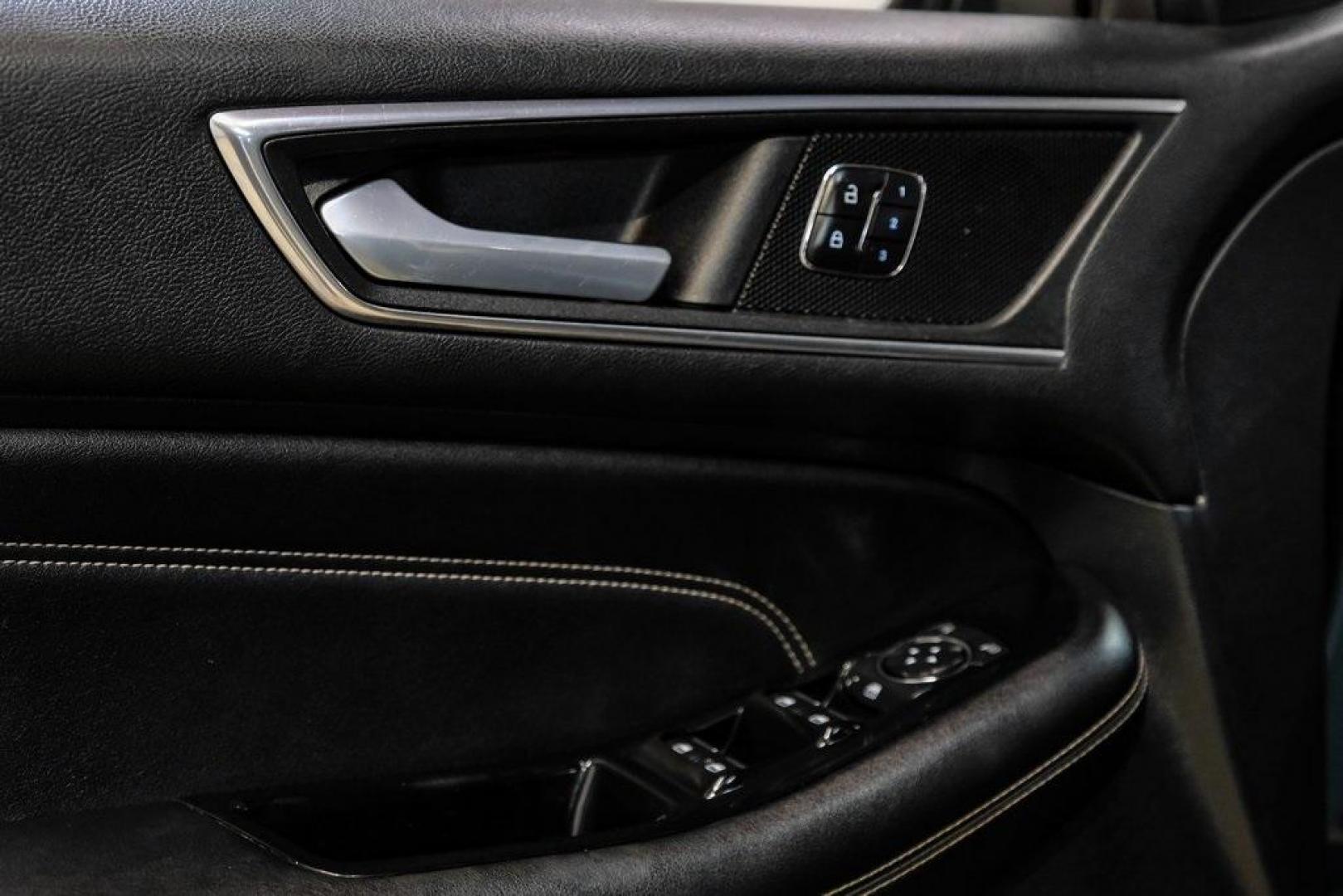 2016 Blue Metallic /Ebony Ford Edge Titanium (2FMPK4K87GB) with an 3.5L V6 Ti-VCT engine, Automatic transmission, located at 15300 Midway Rd., Addison, TX, 75001, (972) 702-0011, 32.958321, -96.838074 - 2016 Ford Edge Titanium AWD<br><br>Now Available at Midway Auto Group Addison, Texas<br><br>Refined, comfortable, and well-equipped, the 2016 Ford Edge Titanium AWD delivers a premium midsize SUV experience with modern technology, a quiet ride, and confident all-wheel-drive capability. As one of th - Photo#52