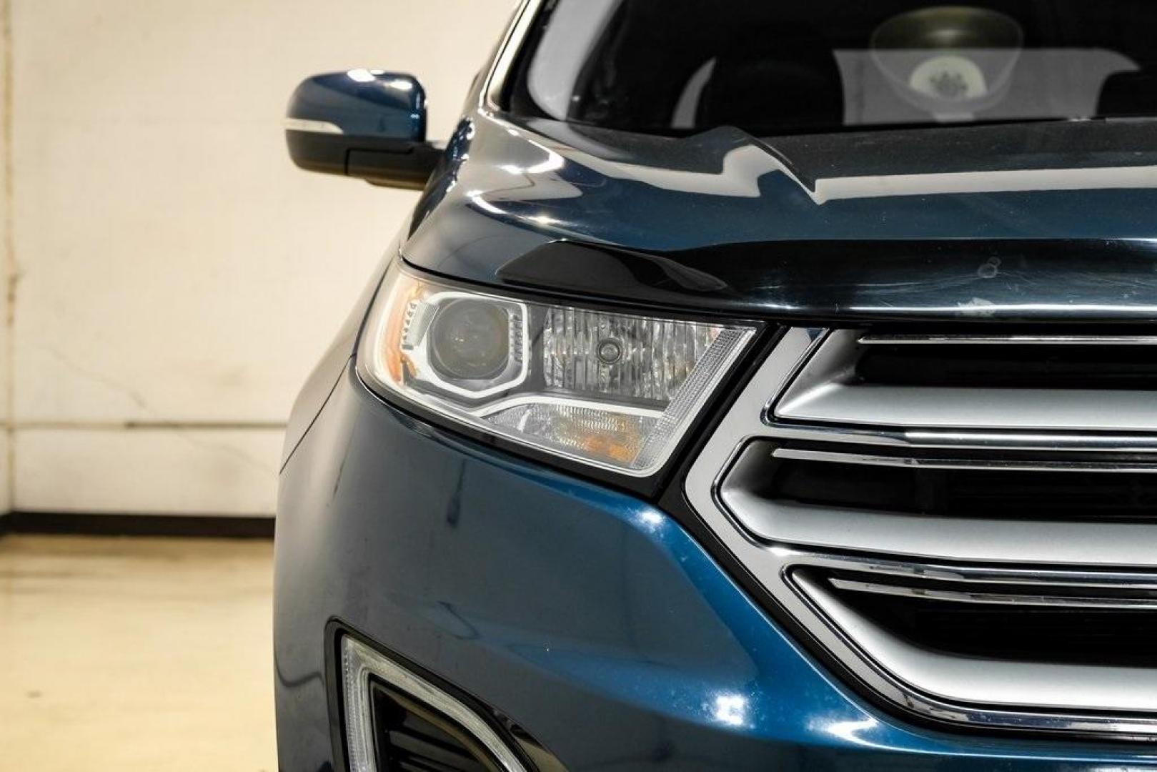 2016 Blue Metallic /Ebony Ford Edge Titanium (2FMPK4K87GB) with an 3.5L V6 Ti-VCT engine, Automatic transmission, located at 15300 Midway Rd., Addison, TX, 75001, (972) 702-0011, 32.958321, -96.838074 - 2016 Ford Edge Titanium AWD<br><br>Now Available at Midway Auto Group Addison, Texas<br><br>Refined, comfortable, and well-equipped, the 2016 Ford Edge Titanium AWD delivers a premium midsize SUV experience with modern technology, a quiet ride, and confident all-wheel-drive capability. As one of th - Photo#55