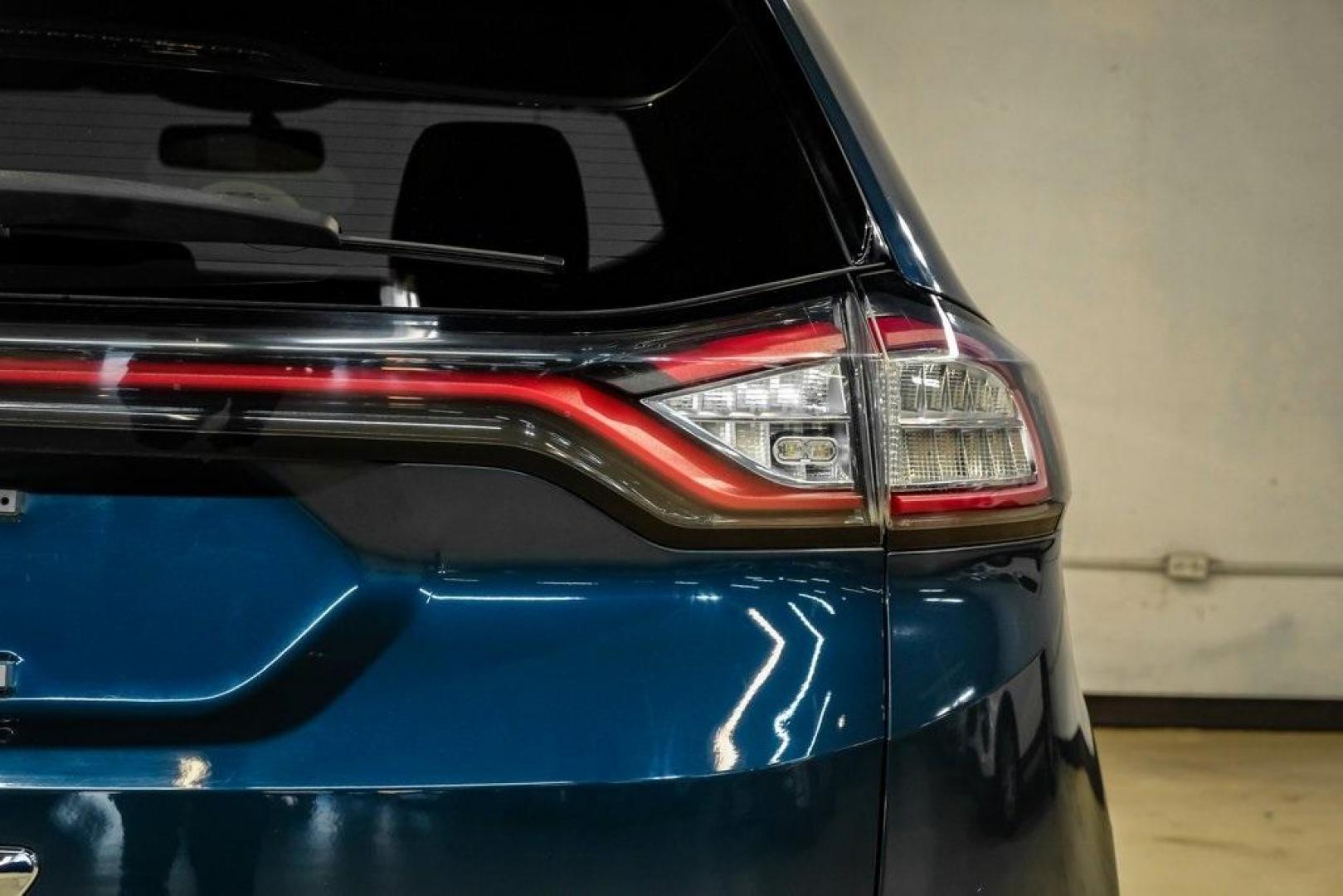 2016 Blue Metallic /Ebony Ford Edge Titanium (2FMPK4K87GB) with an 3.5L V6 Ti-VCT engine, Automatic transmission, located at 15300 Midway Rd., Addison, TX, 75001, (972) 702-0011, 32.958321, -96.838074 - 2016 Ford Edge Titanium AWD<br><br>Now Available at Midway Auto Group Addison, Texas<br><br>Refined, comfortable, and well-equipped, the 2016 Ford Edge Titanium AWD delivers a premium midsize SUV experience with modern technology, a quiet ride, and confident all-wheel-drive capability. As one of th - Photo#56