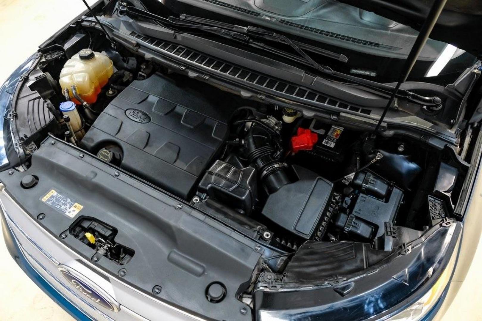 2016 Blue Metallic /Ebony Ford Edge Titanium (2FMPK4K87GB) with an 3.5L V6 Ti-VCT engine, Automatic transmission, located at 15300 Midway Rd., Addison, TX, 75001, (972) 702-0011, 32.958321, -96.838074 - 2016 Ford Edge Titanium AWD<br><br>Now Available at Midway Auto Group Addison, Texas<br><br>Refined, comfortable, and well-equipped, the 2016 Ford Edge Titanium AWD delivers a premium midsize SUV experience with modern technology, a quiet ride, and confident all-wheel-drive capability. As one of th - Photo#59