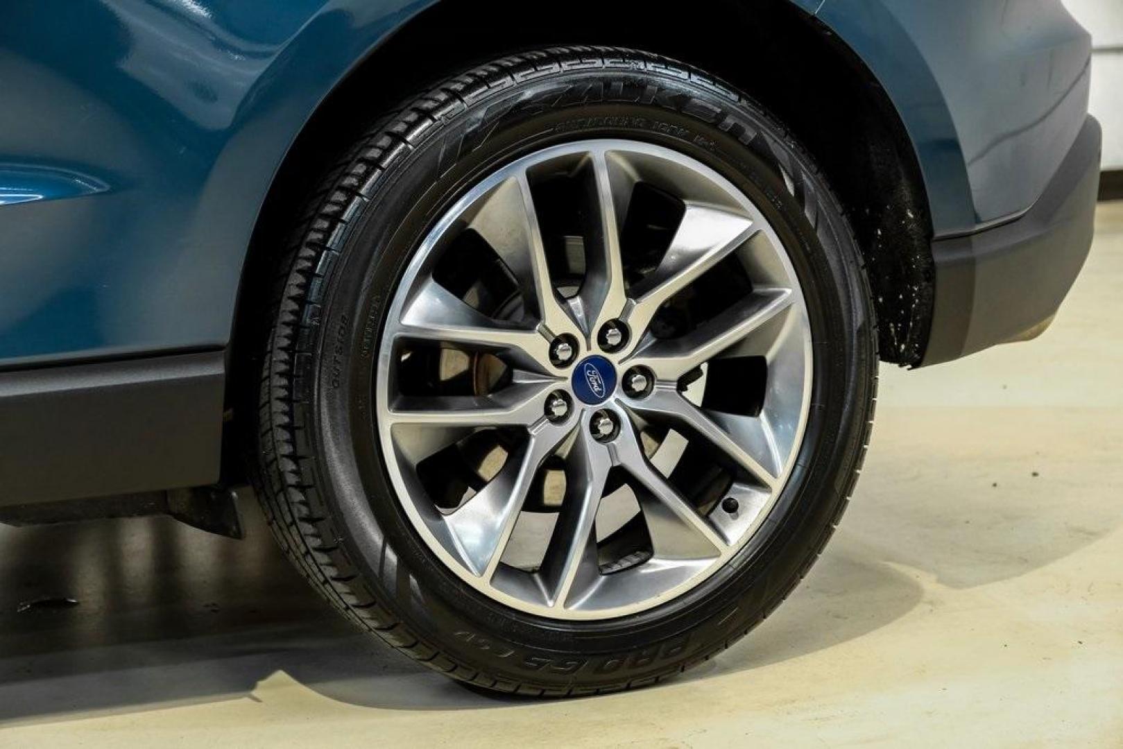 2016 Blue Metallic /Ebony Ford Edge Titanium (2FMPK4K87GB) with an 3.5L V6 Ti-VCT engine, Automatic transmission, located at 15300 Midway Rd., Addison, TX, 75001, (972) 702-0011, 32.958321, -96.838074 - 2016 Ford Edge Titanium AWD<br><br>Now Available at Midway Auto Group Addison, Texas<br><br>Refined, comfortable, and well-equipped, the 2016 Ford Edge Titanium AWD delivers a premium midsize SUV experience with modern technology, a quiet ride, and confident all-wheel-drive capability. As one of th - Photo#69