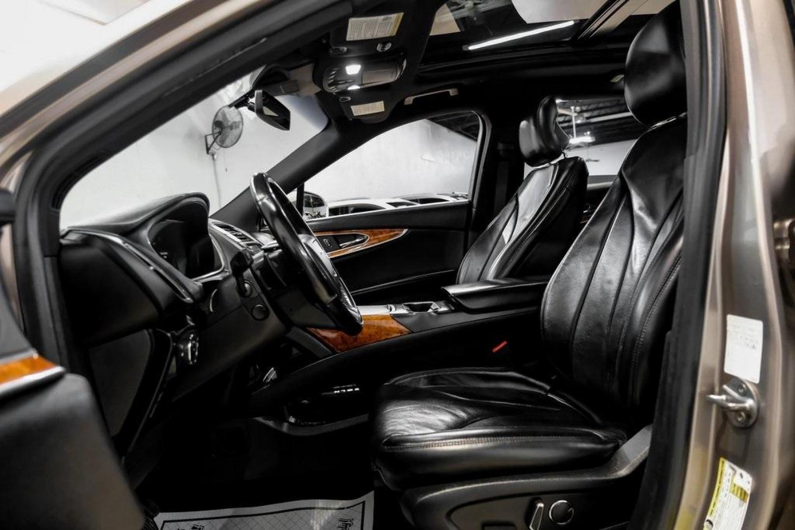 2019 Mocha /Ebony Lincoln Nautilus Reserve (2LMPJ6L98KB) with an 2.0L Turbocharged engine, Automatic transmission, located at 15300 Midway Rd., Addison, TX, 75001, (972) 702-0011, 32.958321, -96.838074 - 2019 Lincoln Nautilus Reserve<br><br>Now Available at Midway Auto Group, Addison, Texas<br><br>Luxurious, powerful, and exceptionally refined the 2019 Lincoln Nautilus Reserve represents the peak of Lincoln's midsize SUV craftsmanship. With its premium interior materials, smooth twin-turbocharged pe - Photo#3