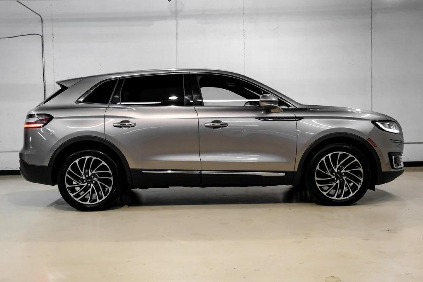 2019 Mocha /Ebony Lincoln Nautilus Reserve (2LMPJ6L98KB) with an 2.0L Turbocharged engine, Automatic transmission, located at 15300 Midway Rd., Addison, TX, 75001, (972) 702-0011, 32.958321, -96.838074 - 2019 Lincoln Nautilus Reserve<br><br>Now Available at Midway Auto Group, Addison, Texas<br><br>Luxurious, powerful, and exceptionally refined the 2019 Lincoln Nautilus Reserve represents the peak of Lincoln's midsize SUV craftsmanship. With its premium interior materials, smooth twin-turbocharged pe - Photo#11