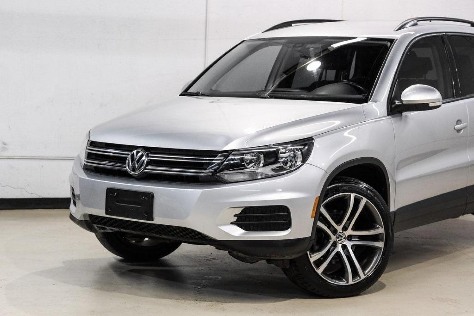 2016 Reflex Silver Metallic Volkswagen Tiguan S (WVGAV7AX0GW) with an 2.0L 4-Cylinder Turbocharged engine, Automatic transmission, located at 15300 Midway Rd., Addison, TX, 75001, (972) 702-0011, 32.958321, -96.838074 - Photo#4