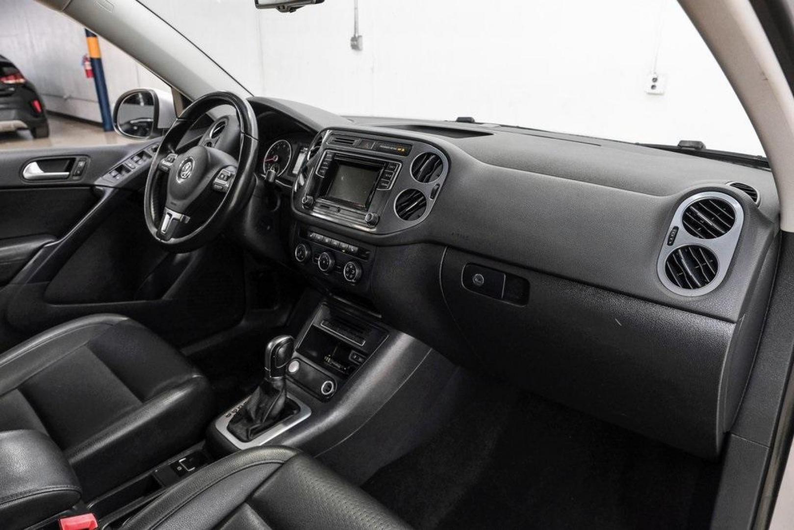 2016 Reflex Silver Metallic Volkswagen Tiguan S (WVGAV7AX0GW) with an 2.0L 4-Cylinder Turbocharged engine, Automatic transmission, located at 15300 Midway Rd., Addison, TX, 75001, (972) 702-0011, 32.958321, -96.838074 - Photo#17