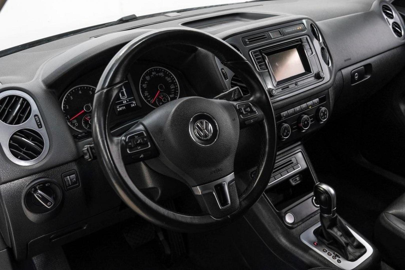 2016 Reflex Silver Metallic Volkswagen Tiguan S (WVGAV7AX0GW) with an 2.0L 4-Cylinder Turbocharged engine, Automatic transmission, located at 15300 Midway Rd., Addison, TX, 75001, (972) 702-0011, 32.958321, -96.838074 - Photo#20