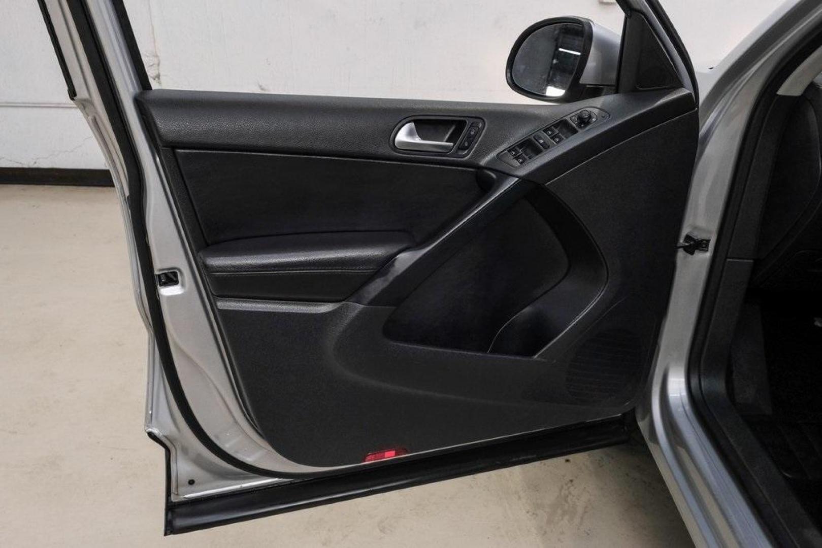 2016 Reflex Silver Metallic Volkswagen Tiguan S (WVGAV7AX0GW) with an 2.0L 4-Cylinder Turbocharged engine, Automatic transmission, located at 15300 Midway Rd., Addison, TX, 75001, (972) 702-0011, 32.958321, -96.838074 - Photo#50