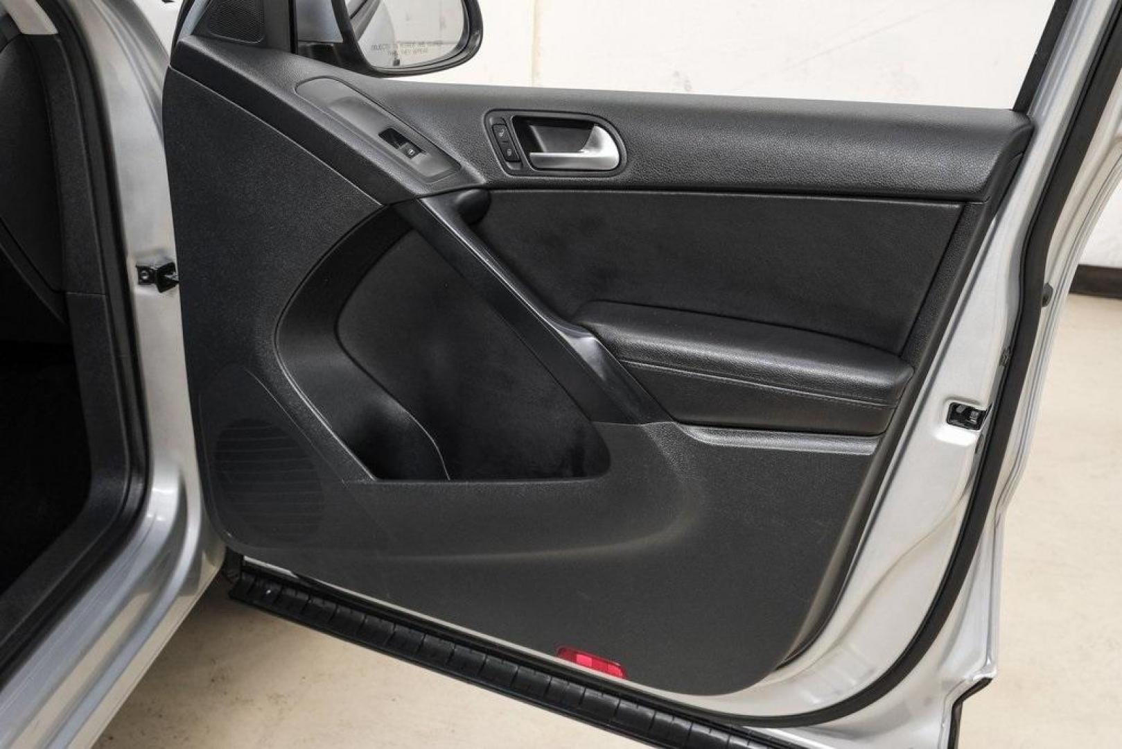 2016 Reflex Silver Metallic Volkswagen Tiguan S (WVGAV7AX0GW) with an 2.0L 4-Cylinder Turbocharged engine, Automatic transmission, located at 15300 Midway Rd., Addison, TX, 75001, (972) 702-0011, 32.958321, -96.838074 - Photo#52