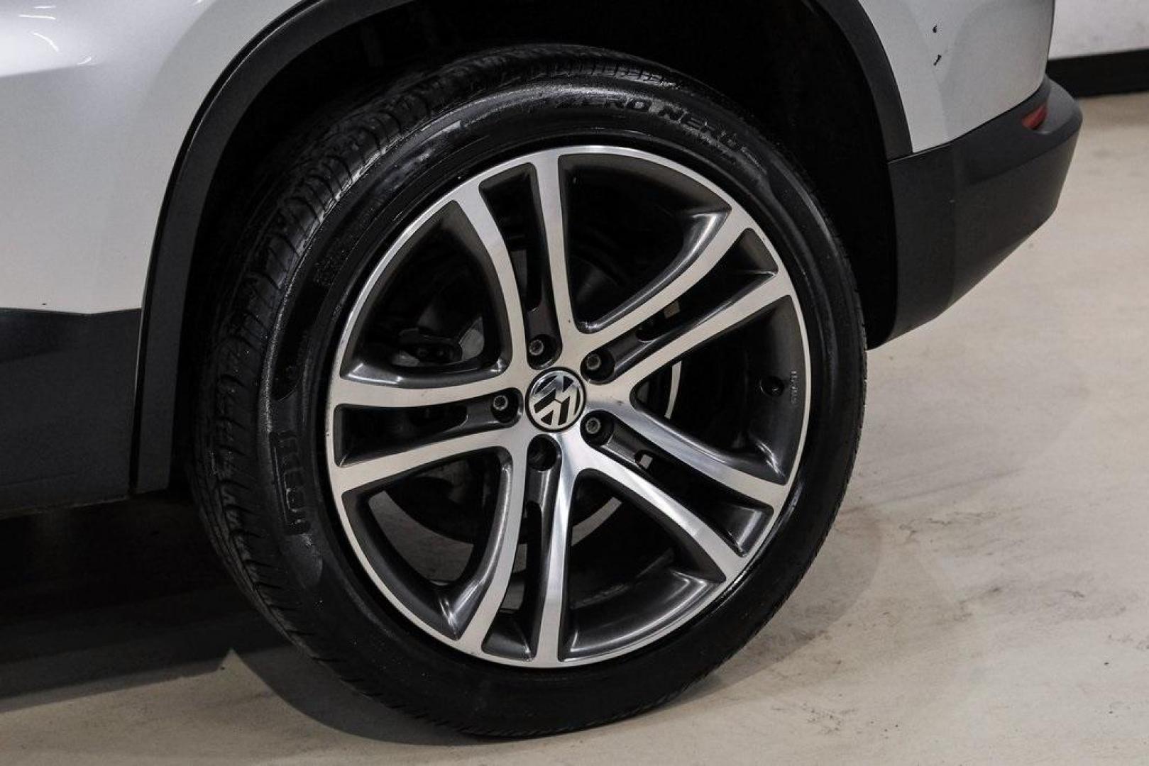 2016 Reflex Silver Metallic Volkswagen Tiguan S (WVGAV7AX0GW) with an 2.0L 4-Cylinder Turbocharged engine, Automatic transmission, located at 15300 Midway Rd., Addison, TX, 75001, (972) 702-0011, 32.958321, -96.838074 - Photo#65