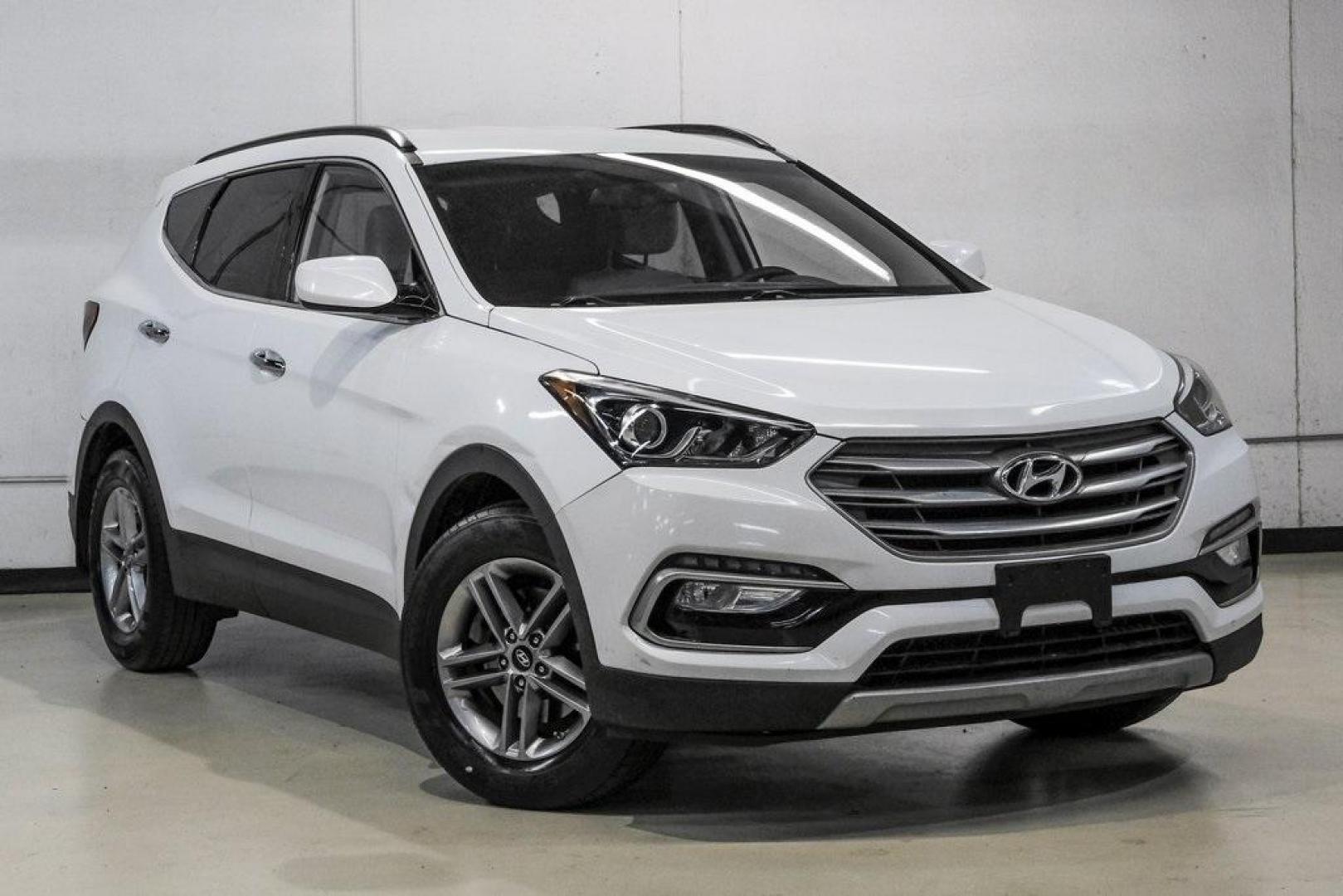 2017 Frost White Pearl /Beige Hyundai Santa Fe Sport 2.4 Base (5NMZUDLB6HH) with an 2.4L I4 DGI DOHC 16V engine, Automatic transmission, located at 15300 Midway Rd., Addison, TX, 75001, (972) 702-0011, 32.958321, -96.838074 - Photo#7