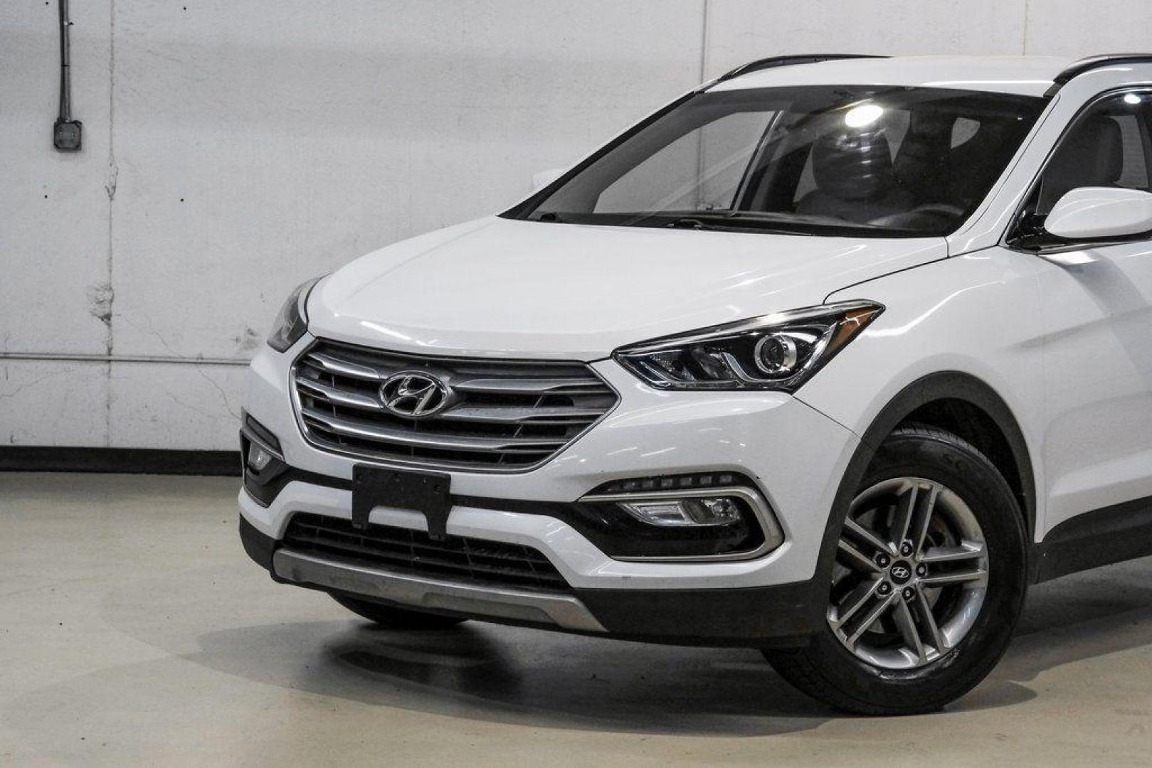 2017 Frost White Pearl /Beige Hyundai Santa Fe Sport 2.4 Base (5NMZUDLB6HH) with an 2.4L I4 DGI DOHC 16V engine, Automatic transmission, located at 15300 Midway Rd., Addison, TX, 75001, (972) 702-0011, 32.958321, -96.838074 - Photo#4