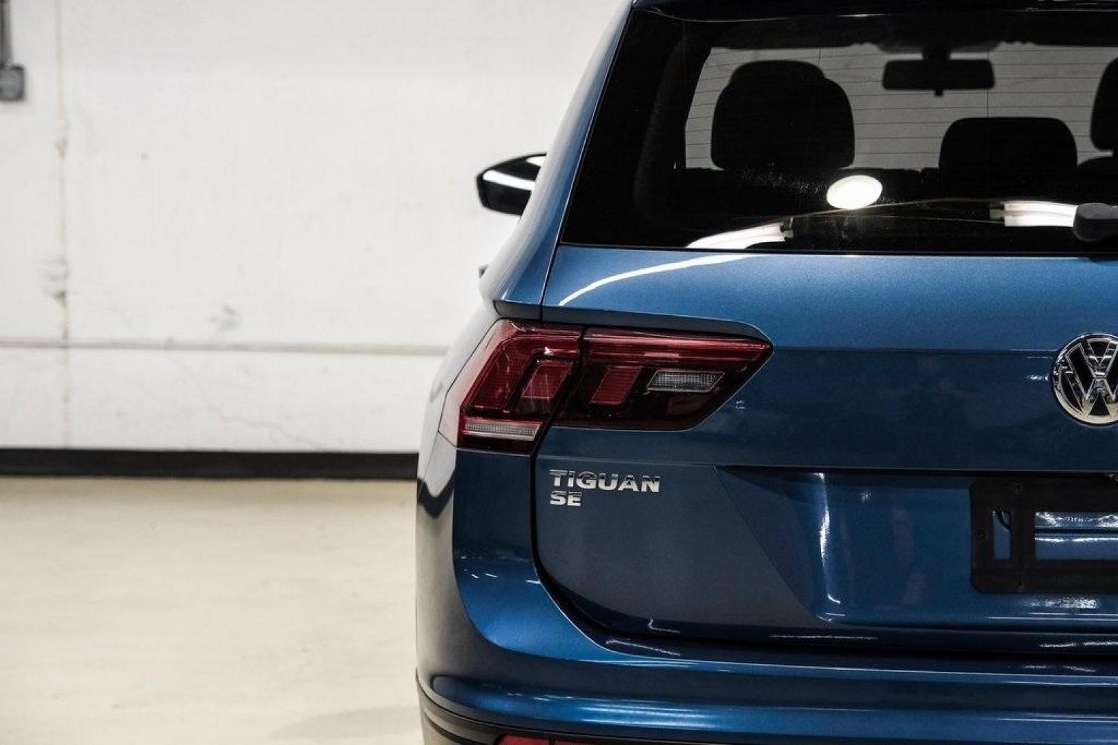 2019 Blue Metallic /Storm Gray Volkswagen Tiguan 2.0T SEL (3VV3B7AX8KM) with an 2.0L TSI DOHC engine, Automatic transmission, located at 15300 Midway Rd., Addison, TX, 75001, (972) 702-0011, 32.958321, -96.838074 - Photo#56