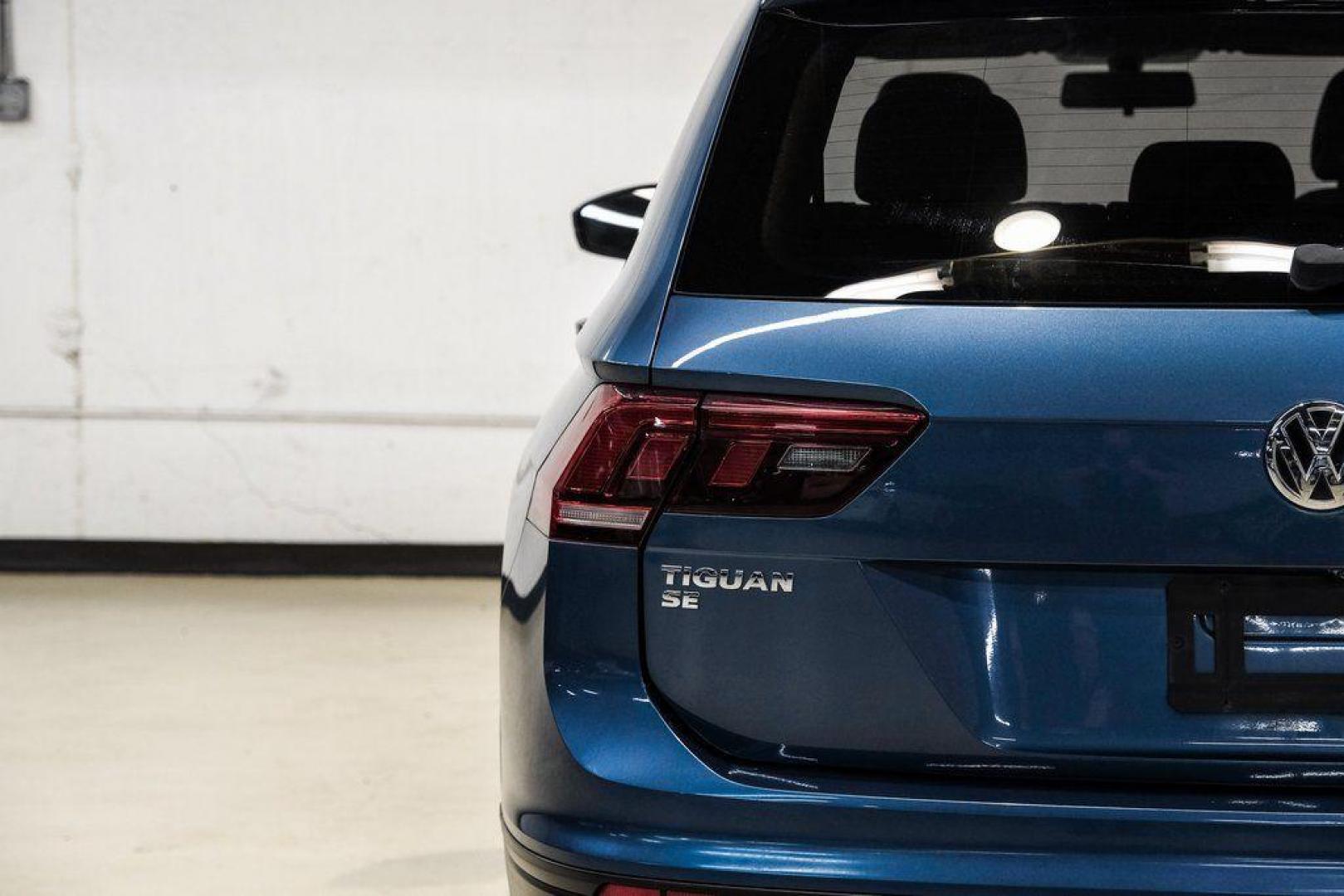 2019 Blue Metallic /Storm Gray Volkswagen Tiguan 2.0T SEL (3VV3B7AX8KM) with an 2.0L TSI DOHC engine, Automatic transmission, located at 15300 Midway Rd., Addison, TX, 75001, (972) 702-0011, 32.958321, -96.838074 - Photo#56