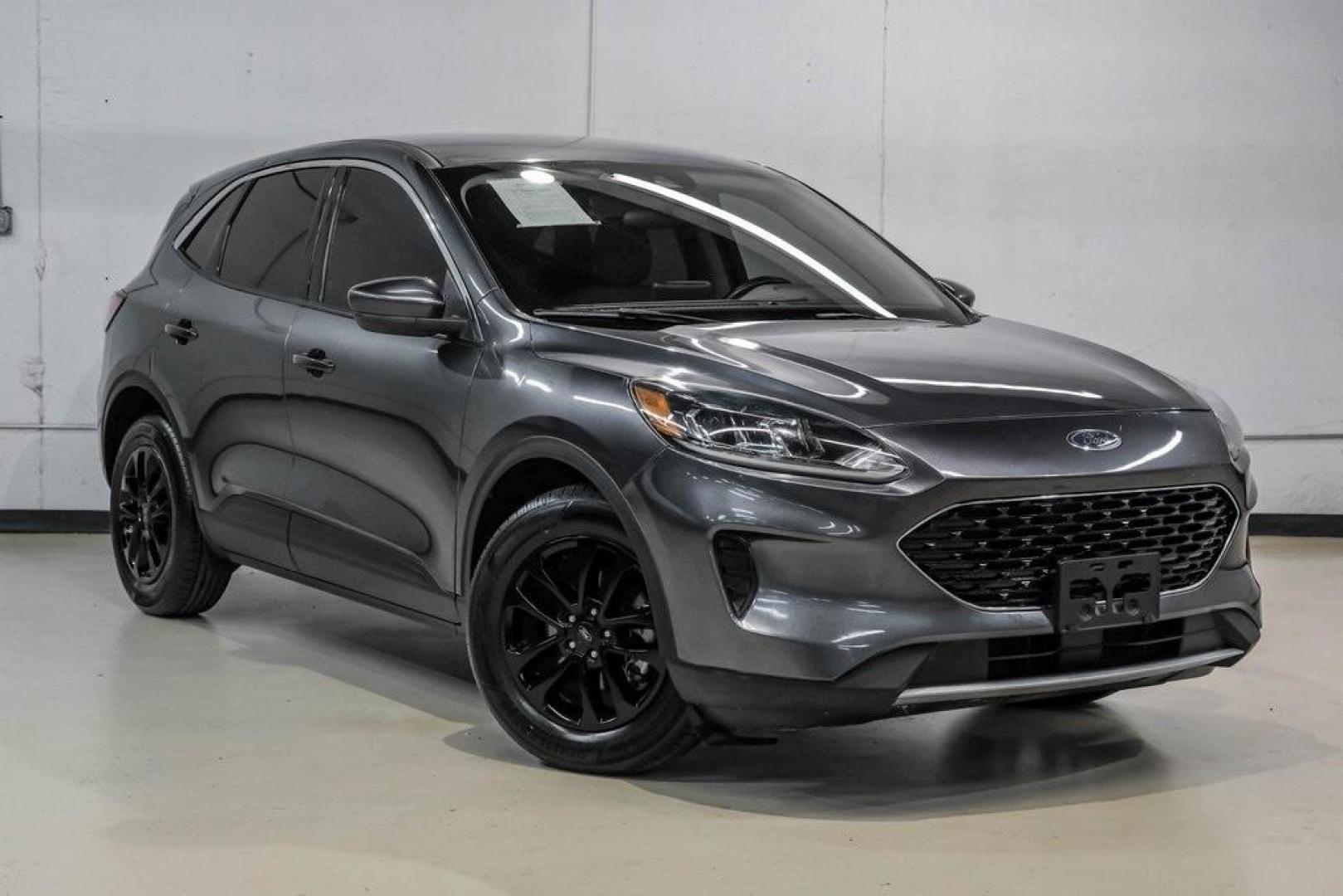 2020 Magnetic /Ebony Ford Escape SE (1FMCU0G62LU) with an 1.5L EcoBoost engine, Automatic transmission, located at 15300 Midway Rd., Addison, TX, 75001, (972) 702-0011, 32.958321, -96.838074 - Photo#7