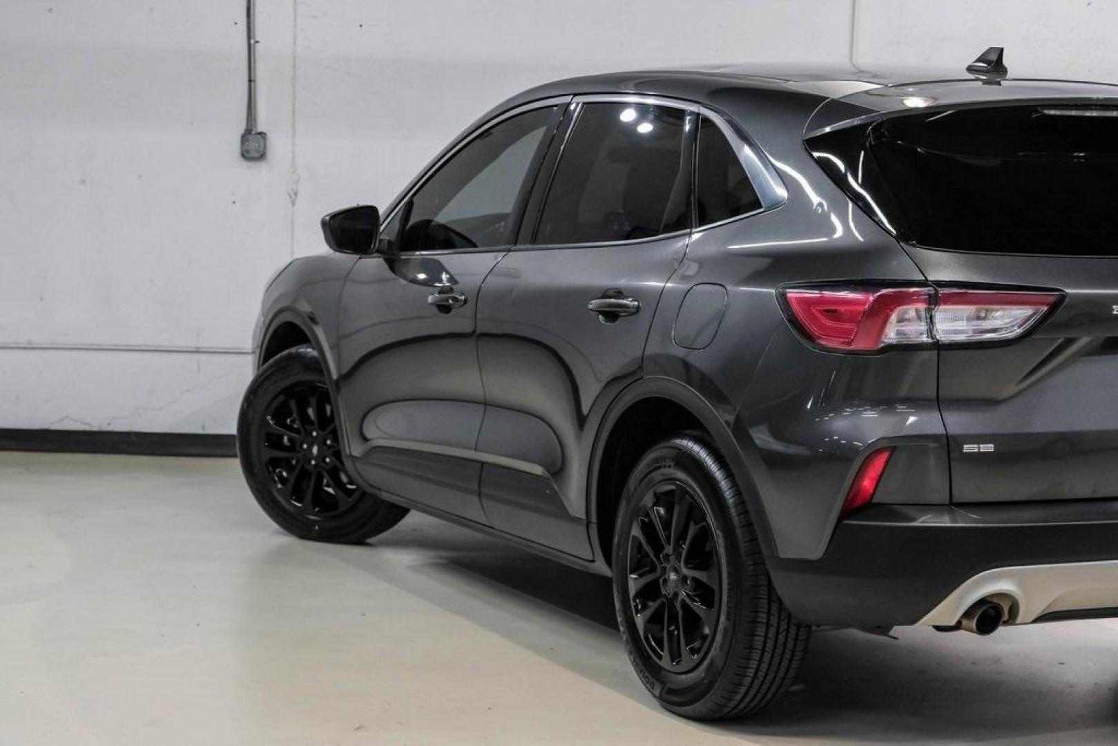 2020 Magnetic /Ebony Ford Escape SE (1FMCU0G62LU) with an 1.5L EcoBoost engine, Automatic transmission, located at 15300 Midway Rd., Addison, TX, 75001, (972) 702-0011, 32.958321, -96.838074 - Photo#11