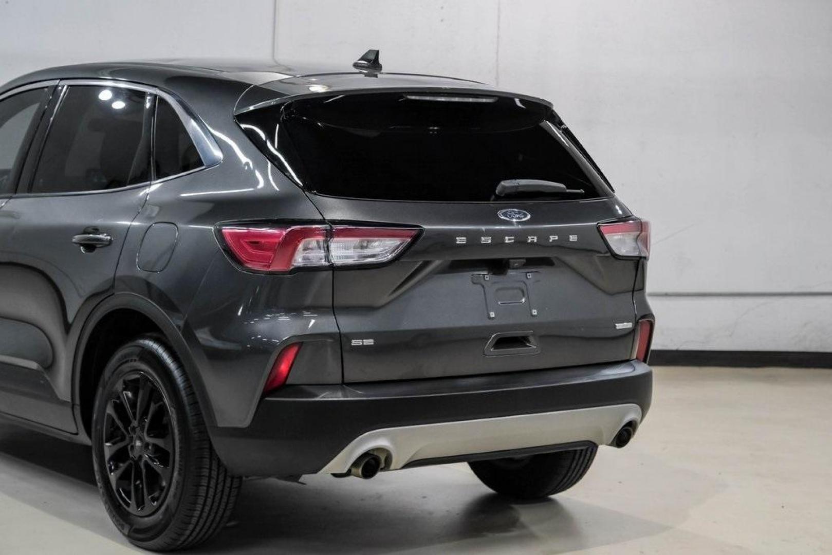 2020 Magnetic /Ebony Ford Escape SE (1FMCU0G62LU) with an 1.5L EcoBoost engine, Automatic transmission, located at 15300 Midway Rd., Addison, TX, 75001, (972) 702-0011, 32.958321, -96.838074 - Photo#12