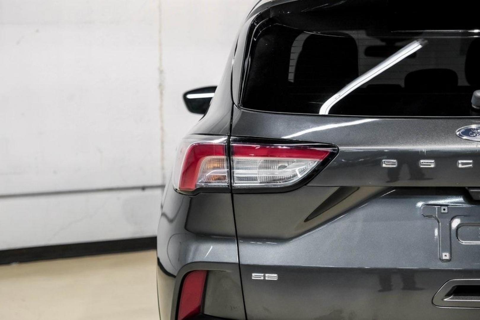 2020 Magnetic /Ebony Ford Escape SE (1FMCU0G62LU) with an 1.5L EcoBoost engine, Automatic transmission, located at 15300 Midway Rd., Addison, TX, 75001, (972) 702-0011, 32.958321, -96.838074 - Photo#54