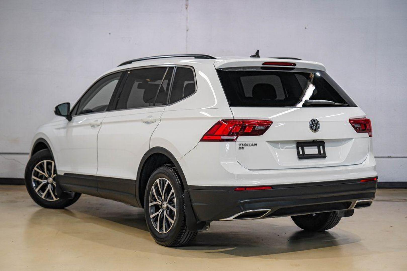 2019 Pure White /Titan Black Volkswagen Tiguan 2.0T SE (3VV3B7AX4KM) with an 2.0L TSI DOHC engine, Automatic transmission, located at 15300 Midway Rd., Addison, TX, 75001, (972) 702-0011, 32.958321, -96.838074 - Photo#11