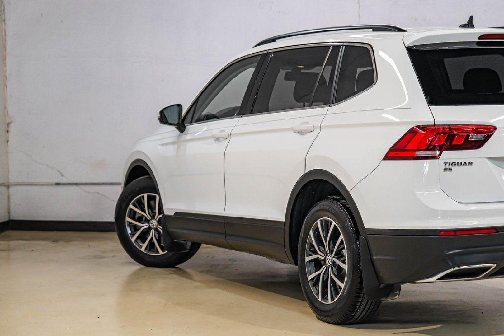 2019 Pure White /Titan Black Volkswagen Tiguan 2.0T SE (3VV3B7AX4KM) with an 2.0L TSI DOHC engine, Automatic transmission, located at 15300 Midway Rd., Addison, TX, 75001, (972) 702-0011, 32.958321, -96.838074 - Photo#12