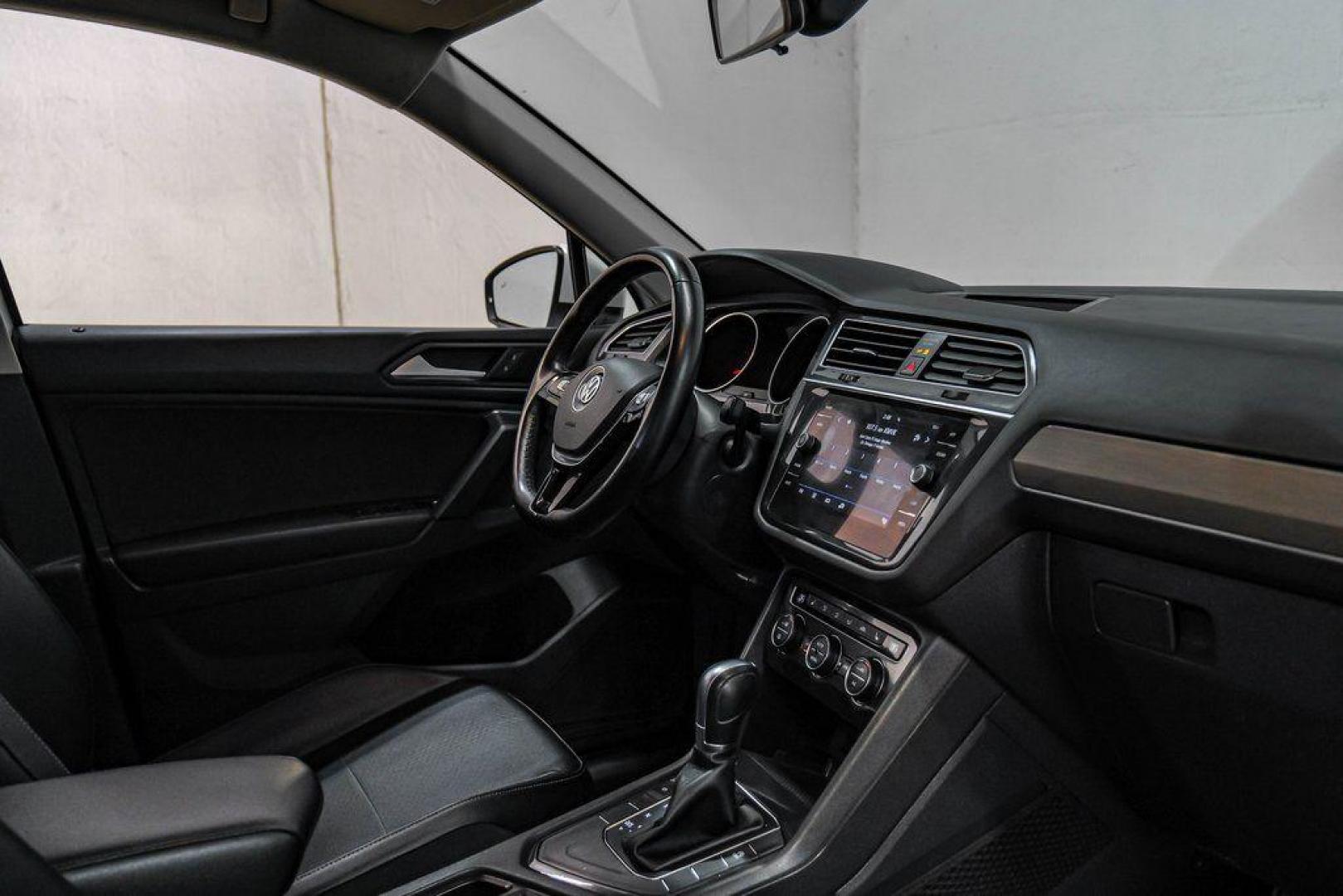 2019 Pure White /Titan Black Volkswagen Tiguan 2.0T SE (3VV3B7AX4KM) with an 2.0L TSI DOHC engine, Automatic transmission, located at 15300 Midway Rd., Addison, TX, 75001, (972) 702-0011, 32.958321, -96.838074 - Photo#28