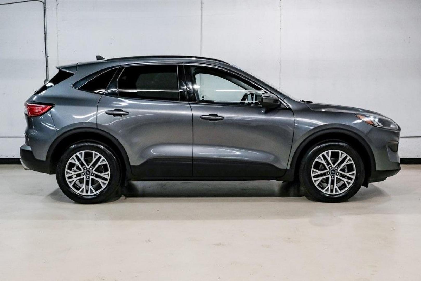 2021 Gray Metallic /Ebony Ford Escape SEL (1FMCU9H6XMU) with an 1.5L EcoBoost engine, Automatic transmission, located at 15300 Midway Rd., Addison, TX, 75001, (972) 702-0011, 32.958321, -96.838074 - Photo#9