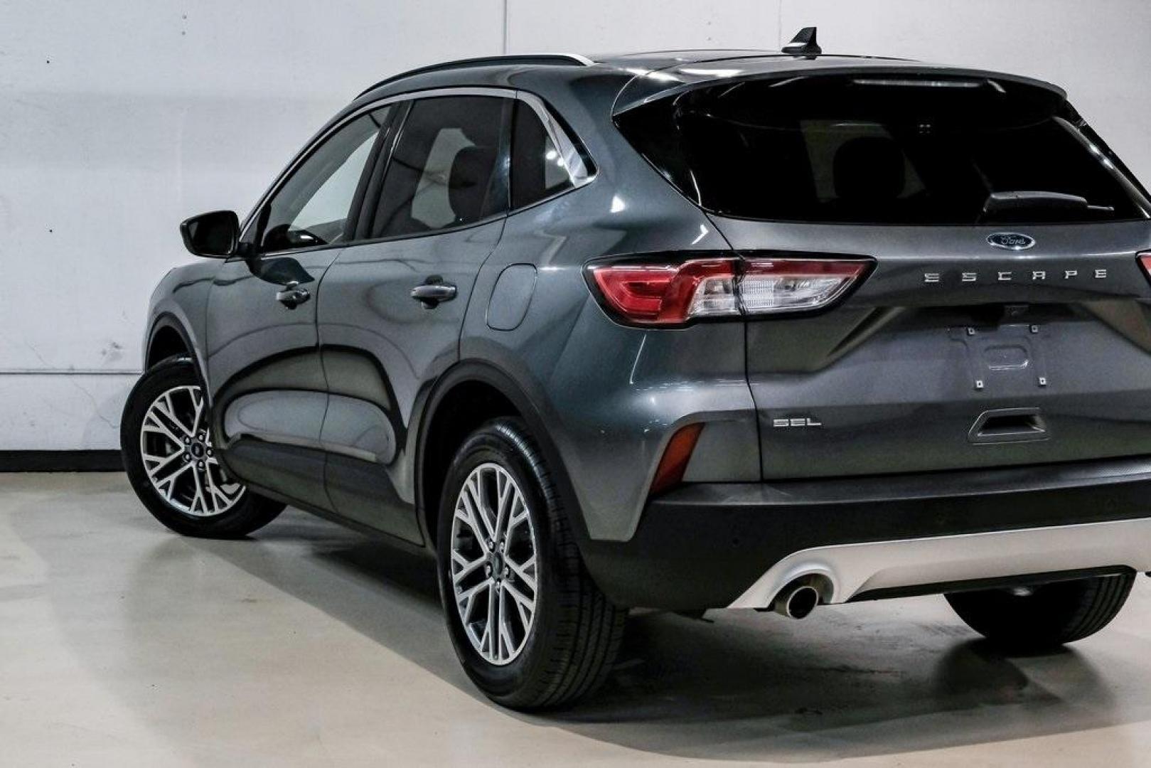 2021 Gray Metallic /Ebony Ford Escape SEL (1FMCU9H6XMU) with an 1.5L EcoBoost engine, Automatic transmission, located at 15300 Midway Rd., Addison, TX, 75001, (972) 702-0011, 32.958321, -96.838074 - Photo#13