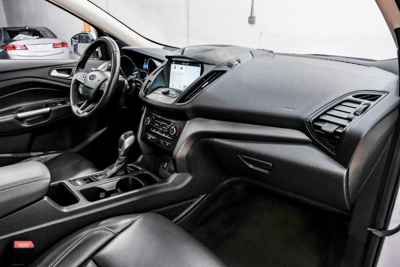 2019 Oxford White /Charcoal Black Ford Escape SEL (1FMCU9HD1KU) with an 1.5L EcoBoost engine, Automatic transmission, located at 15300 Midway Rd., Addison, TX, 75001, (972) 702-0011, 32.958321, -96.838074 - Photo#18