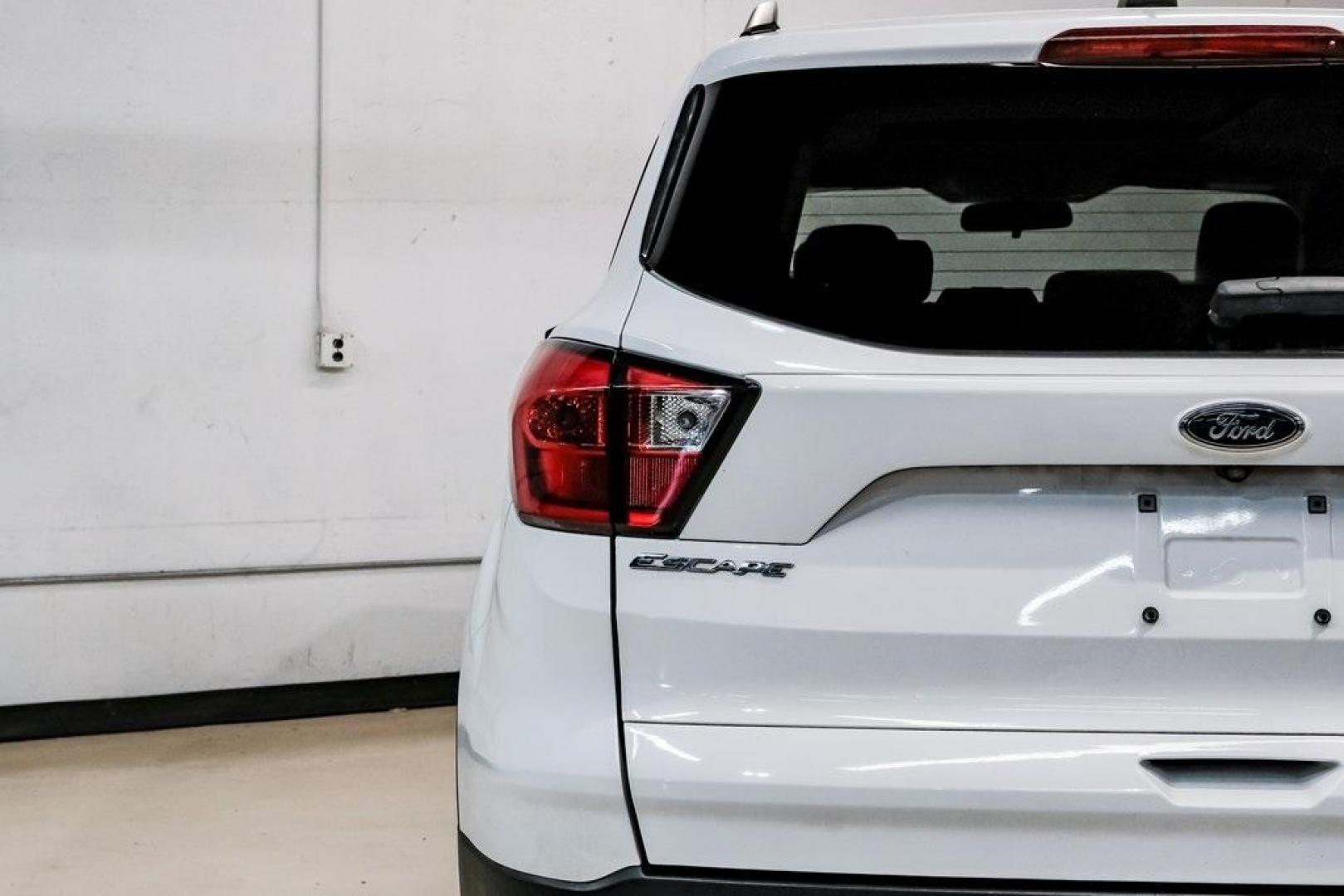 2019 Oxford White /Charcoal Black Ford Escape SEL (1FMCU9HD1KU) with an 1.5L EcoBoost engine, Automatic transmission, located at 15300 Midway Rd., Addison, TX, 75001, (972) 702-0011, 32.958321, -96.838074 - Photo#52