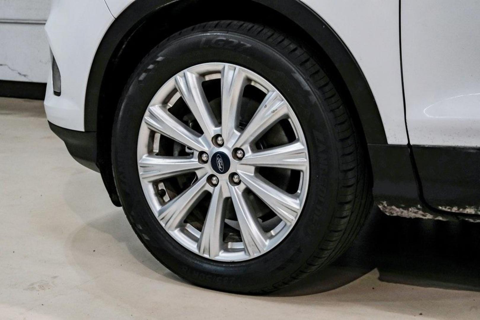 2019 Oxford White /Charcoal Black Ford Escape SEL (1FMCU9HD1KU) with an 1.5L EcoBoost engine, Automatic transmission, located at 15300 Midway Rd., Addison, TX, 75001, (972) 702-0011, 32.958321, -96.838074 - Photo#63