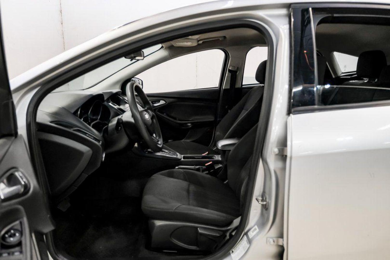 2018 Ingot Silver /Charcoal Black Ford Focus SE (1FADP3K28JL) with an 2.0L I4 DGI Ti-VCT engine, Automatic transmission, located at 15300 Midway Rd., Addison, TX, 75001, (972) 702-0011, 32.958321, -96.838074 - Photo#3