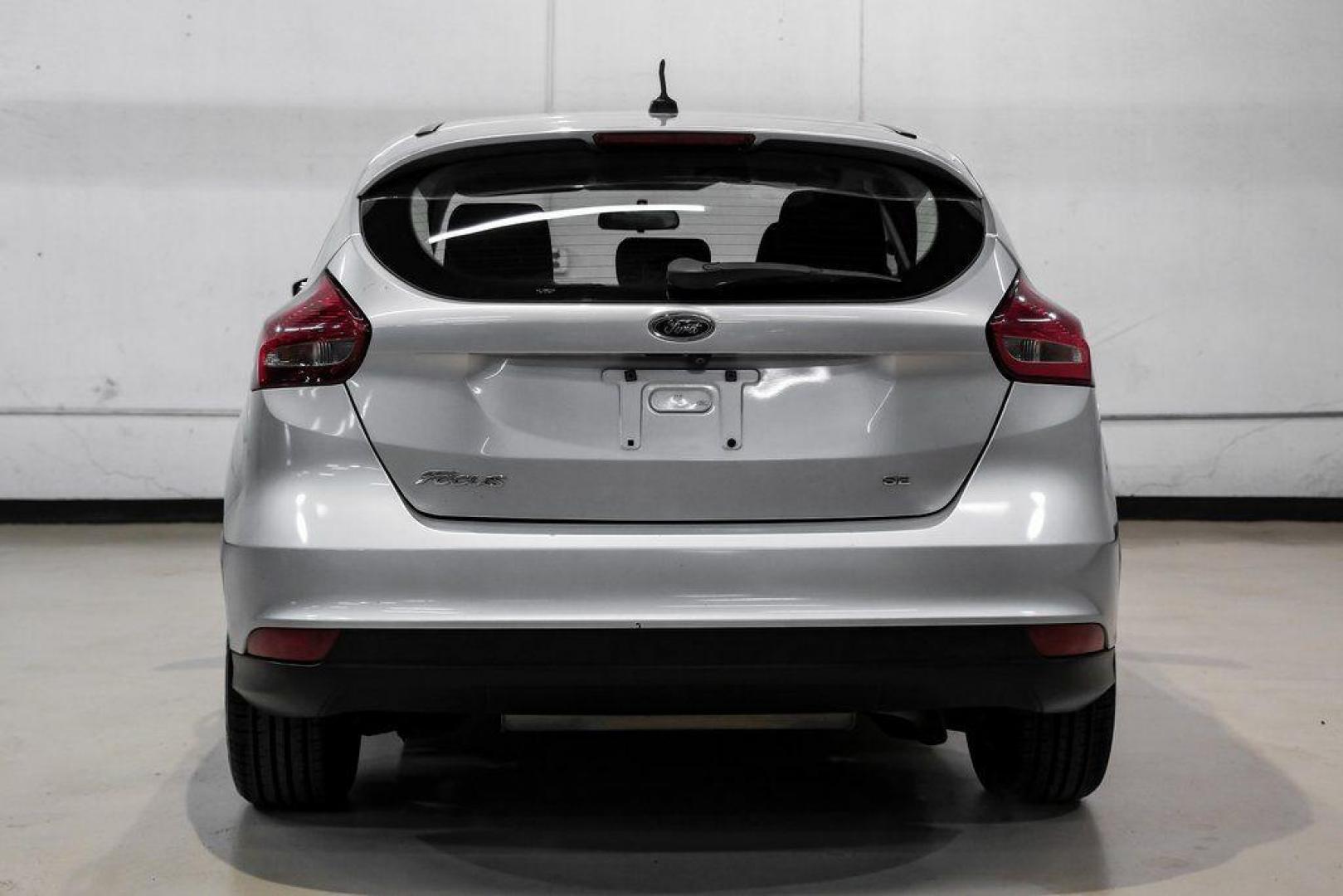 2018 Ingot Silver /Charcoal Black Ford Focus SE (1FADP3K28JL) with an 2.0L I4 DGI Ti-VCT engine, Automatic transmission, located at 15300 Midway Rd., Addison, TX, 75001, (972) 702-0011, 32.958321, -96.838074 - Photo#10