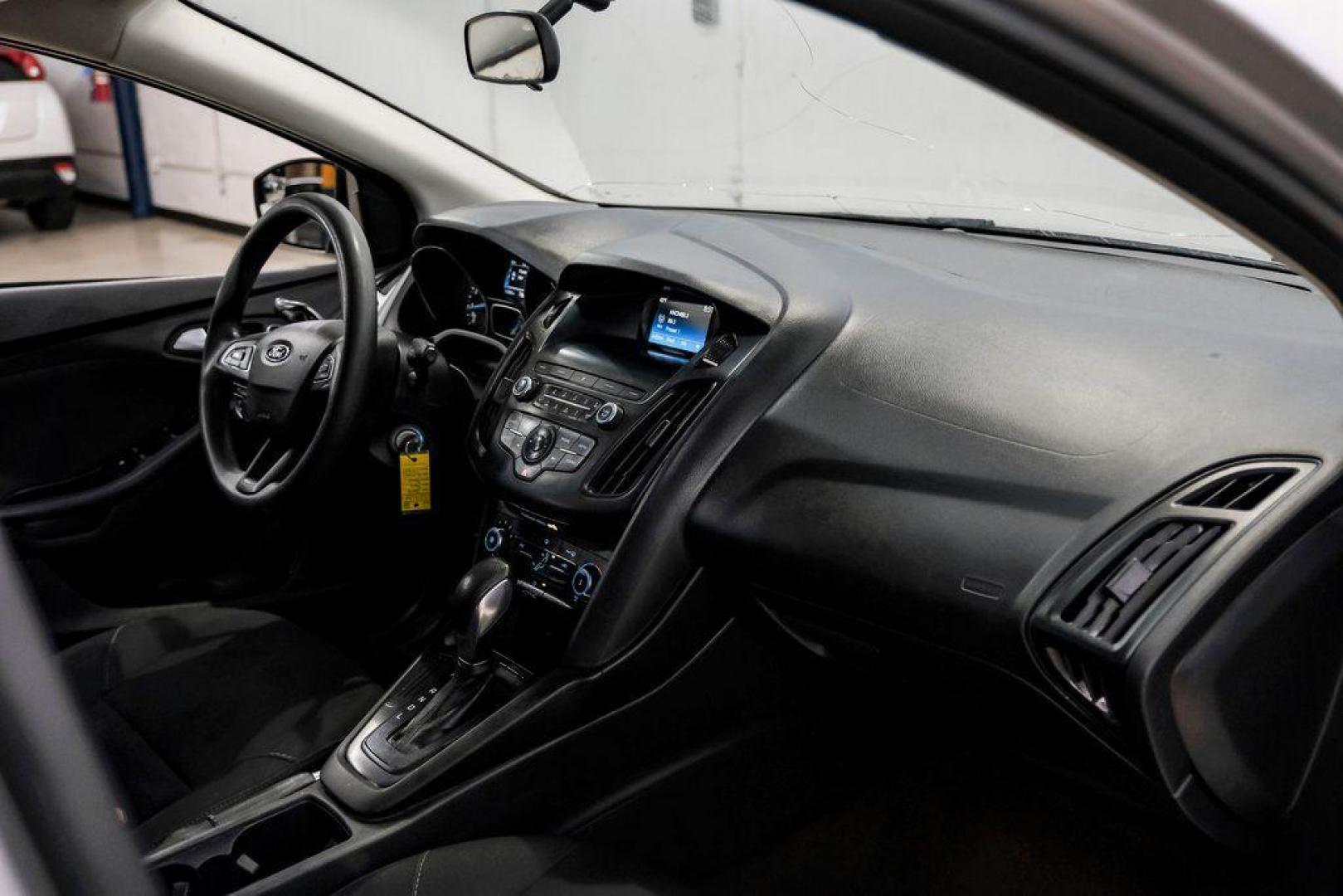 2018 Ingot Silver /Charcoal Black Ford Focus SE (1FADP3K28JL) with an 2.0L I4 DGI Ti-VCT engine, Automatic transmission, located at 15300 Midway Rd., Addison, TX, 75001, (972) 702-0011, 32.958321, -96.838074 - Photo#17