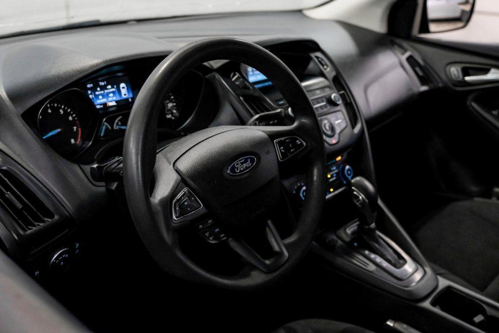 2018 Ingot Silver /Charcoal Black Ford Focus SE (1FADP3K28JL) with an 2.0L I4 DGI Ti-VCT engine, Automatic transmission, located at 15300 Midway Rd., Addison, TX, 75001, (972) 702-0011, 32.958321, -96.838074 - Photo#20